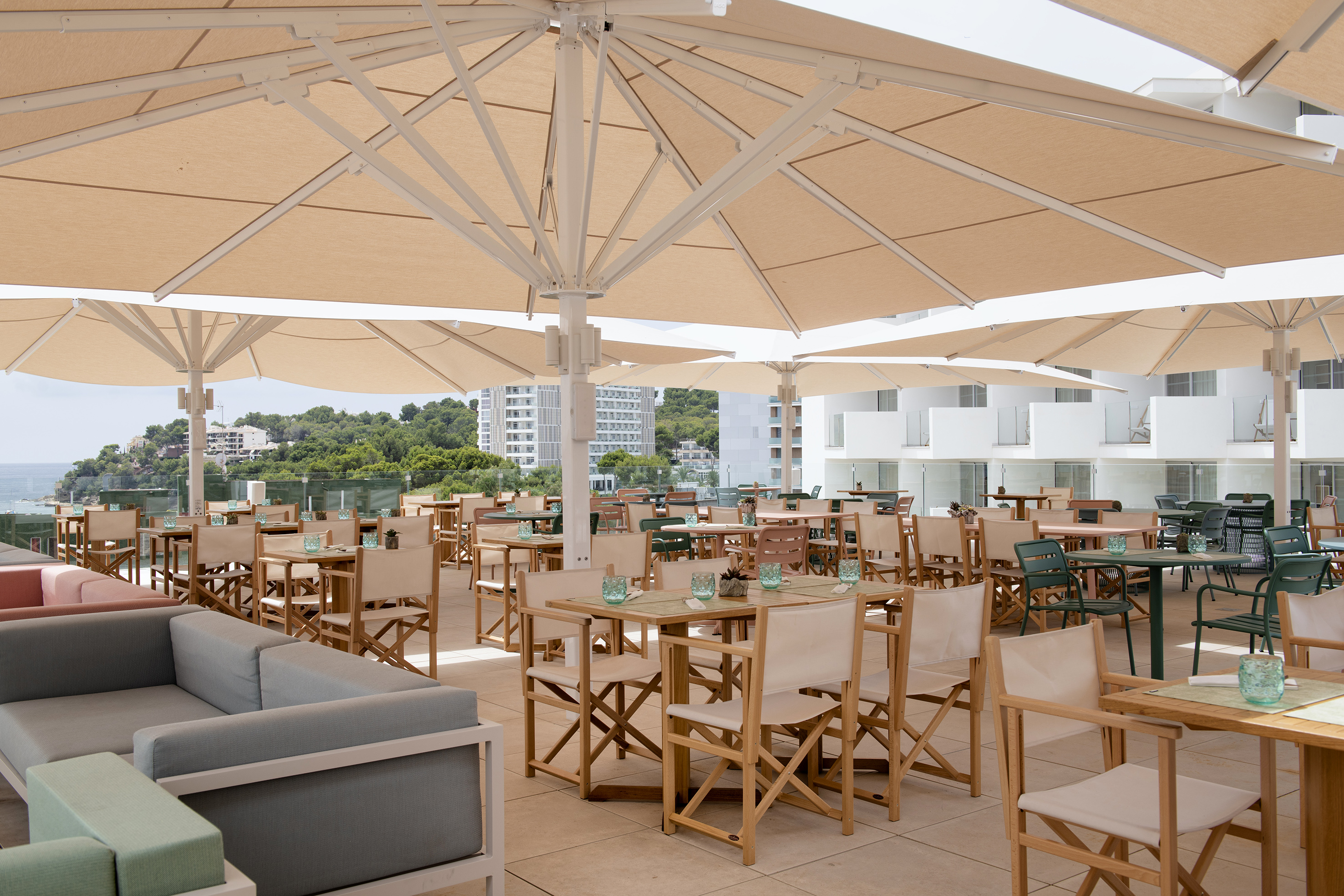 a patio with tables and chairs