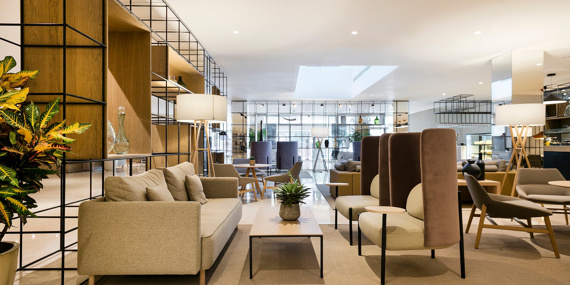 a room with a couch and chairs