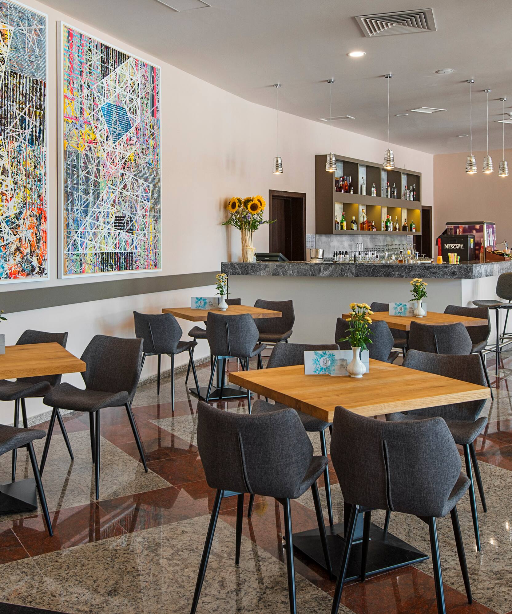 a room with tables and chairs