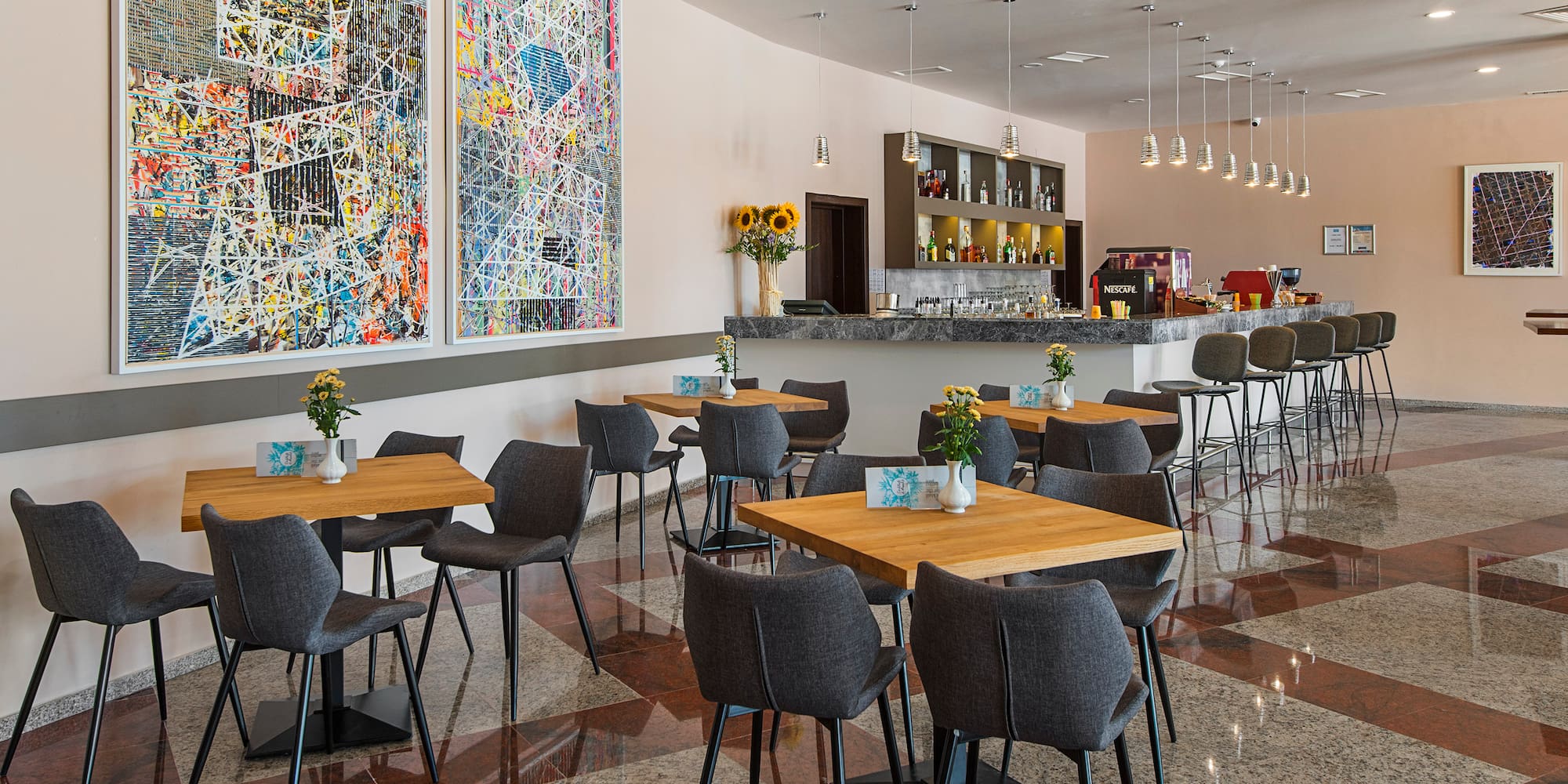 a room with tables and chairs