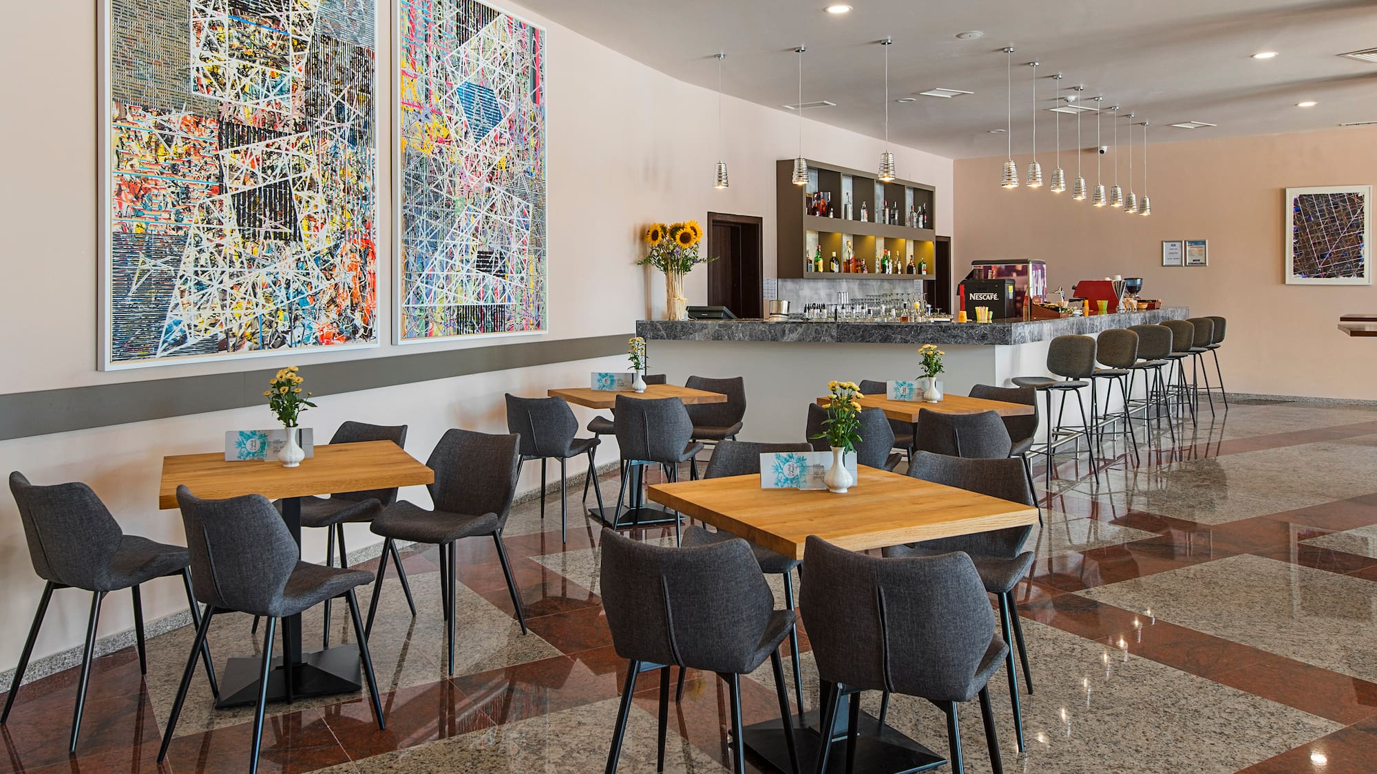 a room with tables and chairs