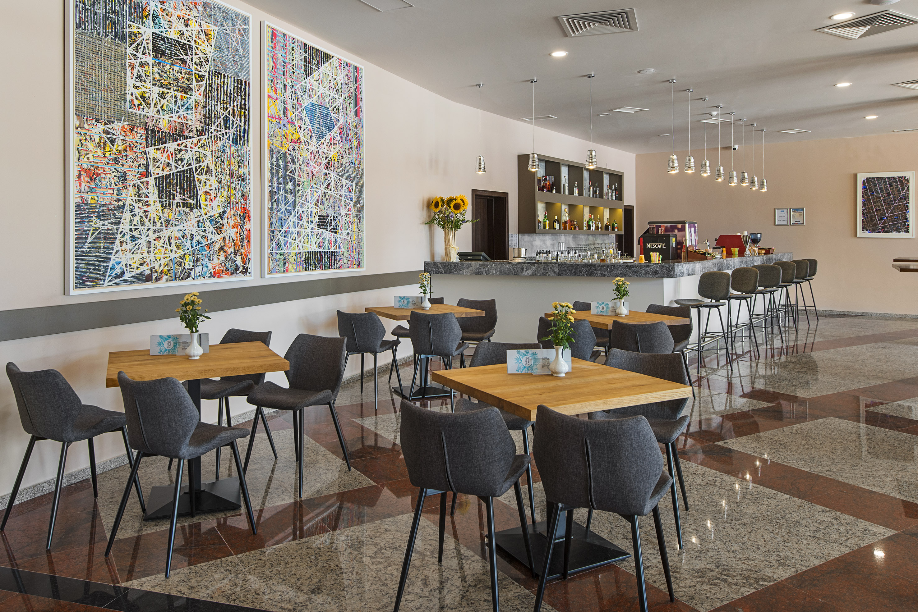 a room with tables and chairs