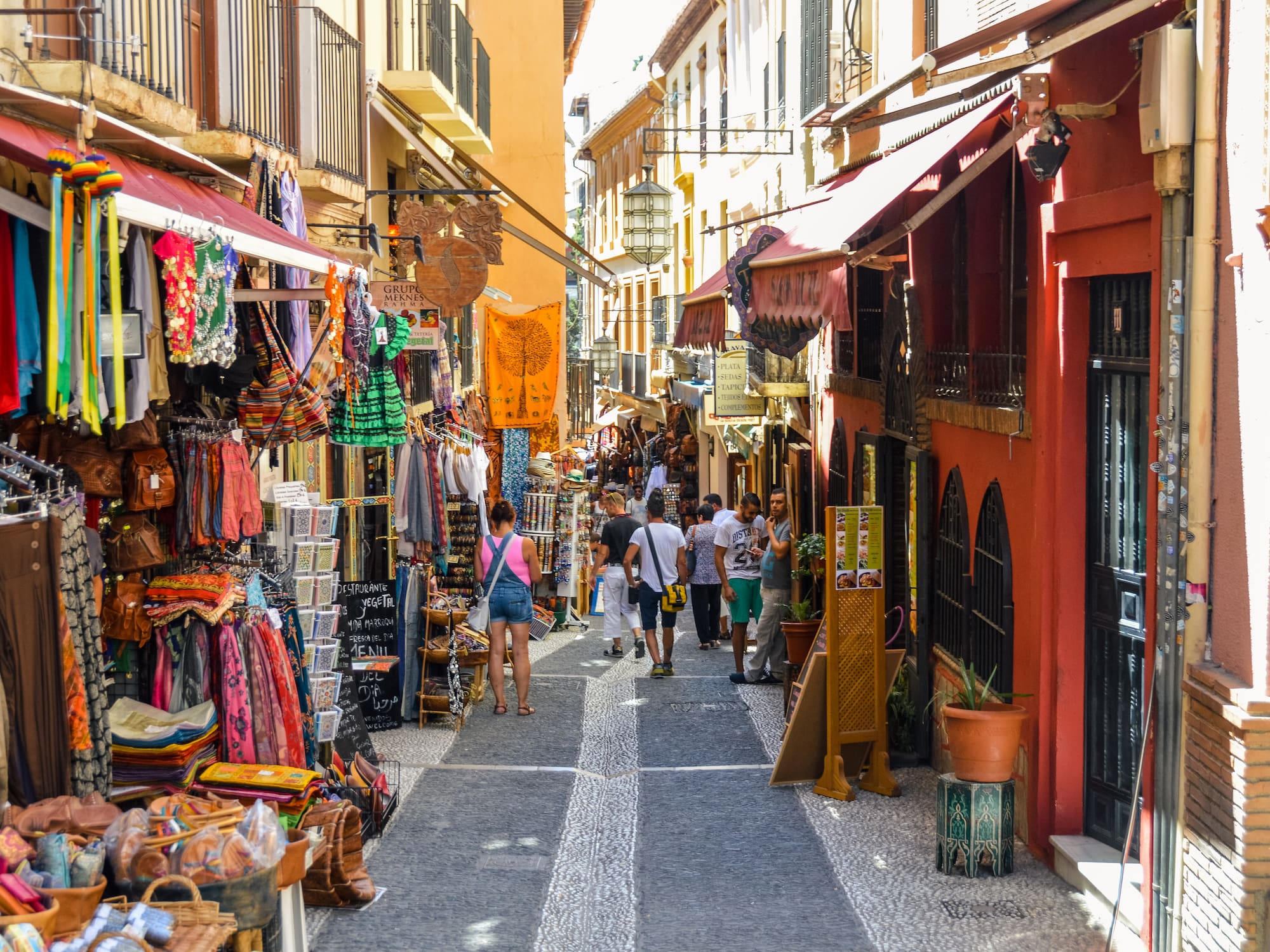 a street with people walking down it