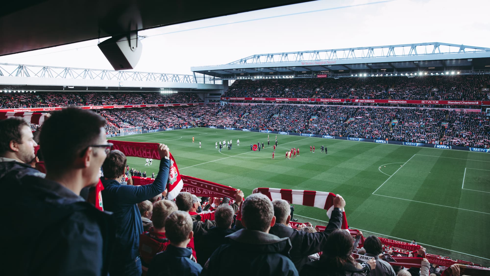 a football stadium with people in the stands