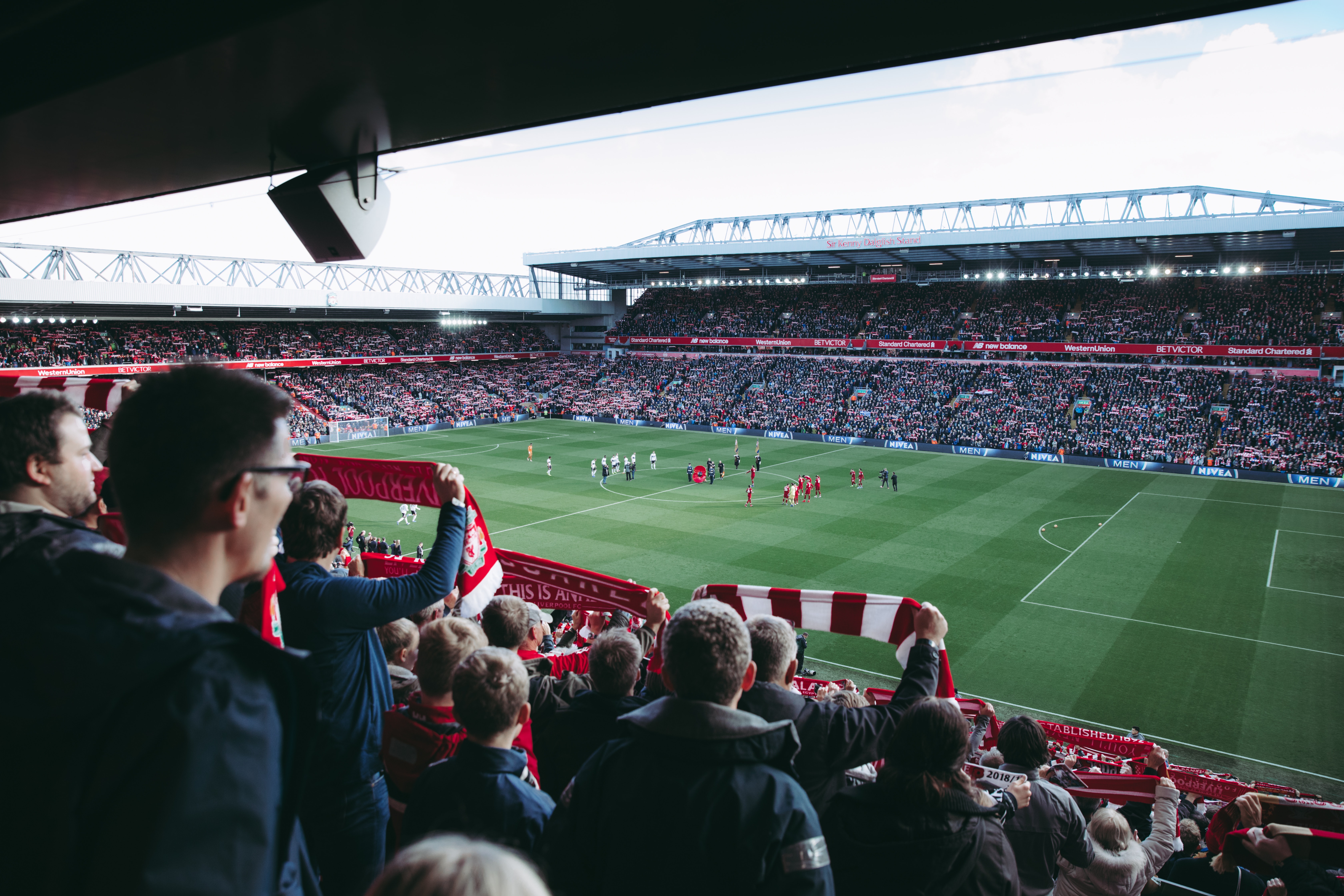 a football stadium with people in the stands