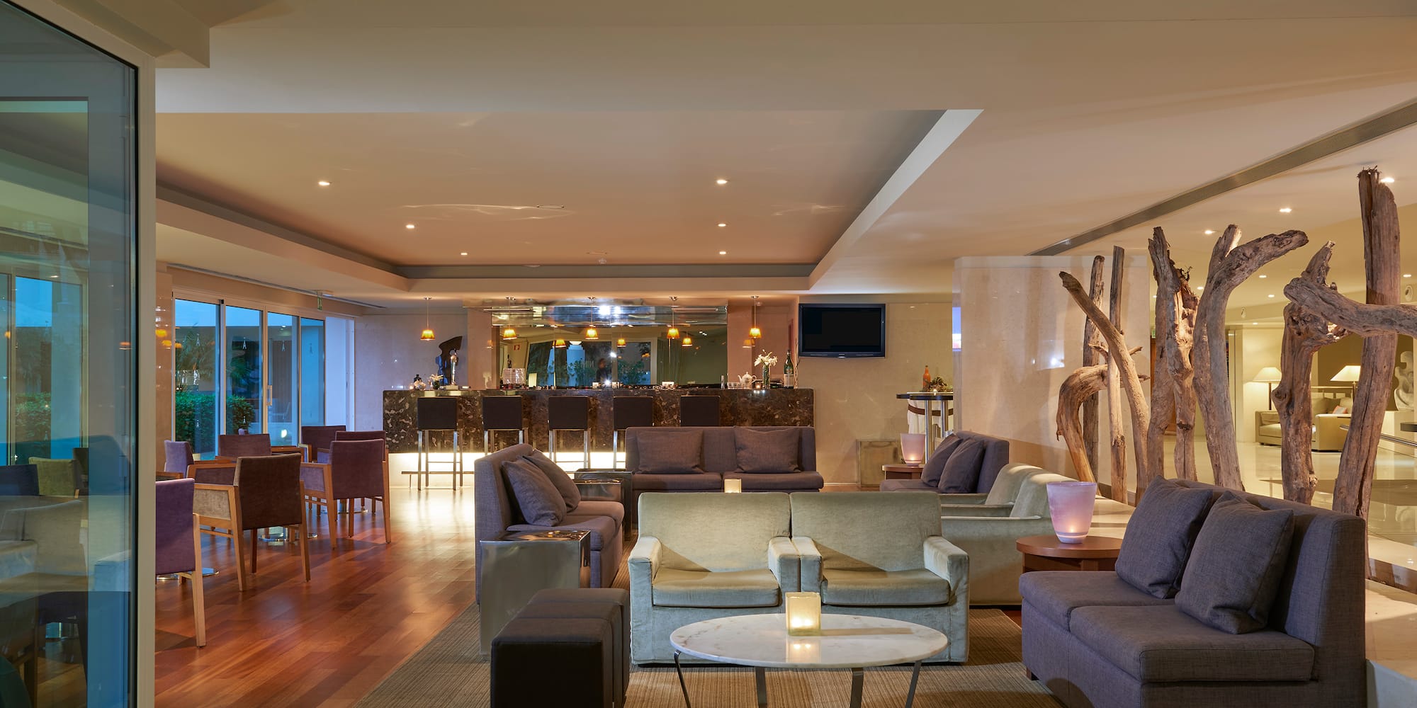 a room with a large table and chairs