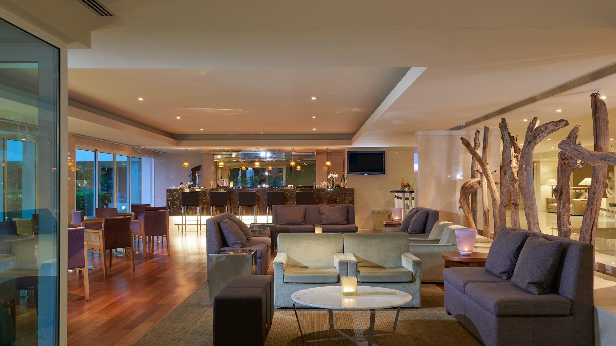 a room with a large table and chairs