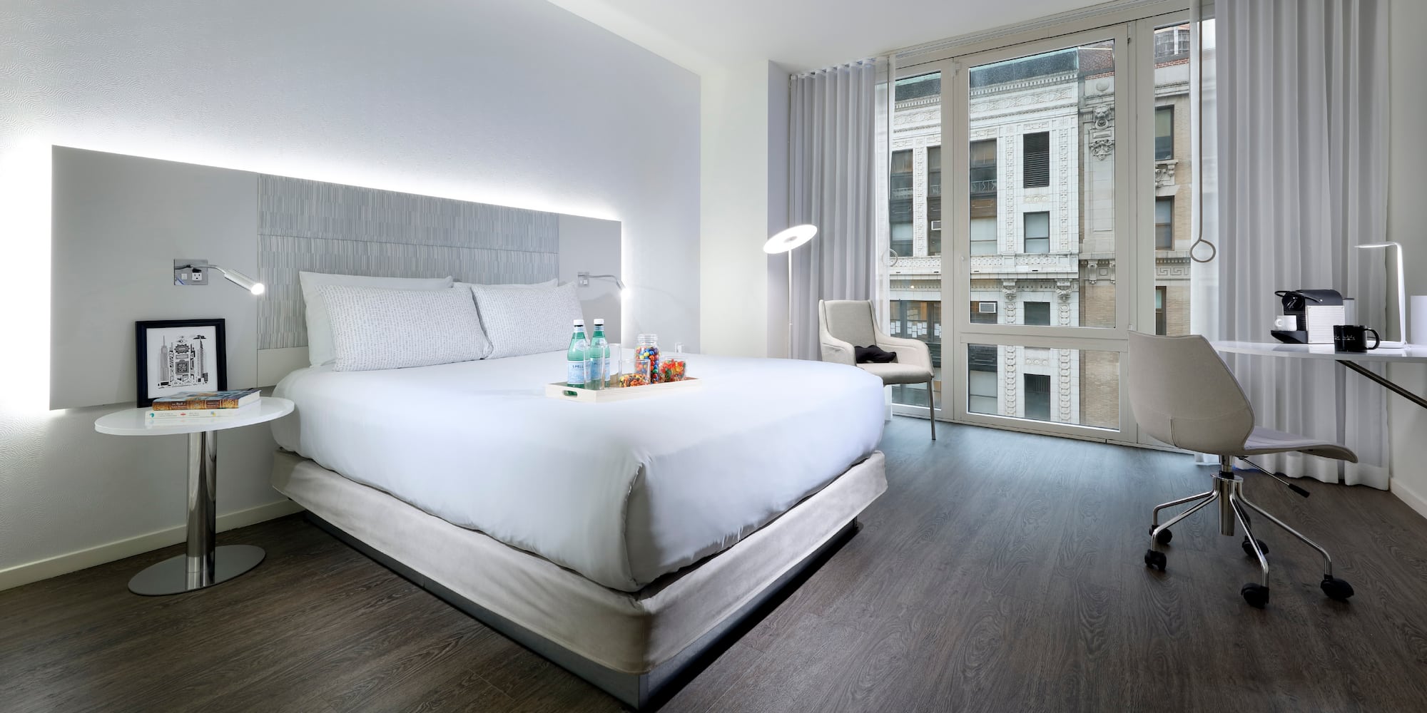 a hotel room with a bed and a chair