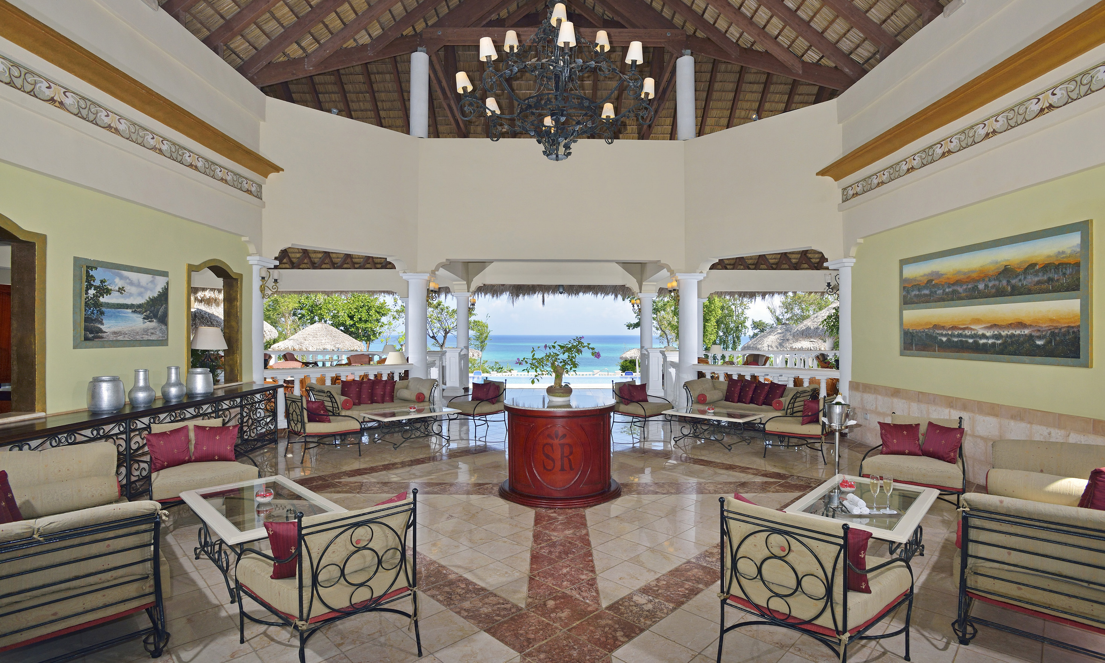 a room with a large table and chairs