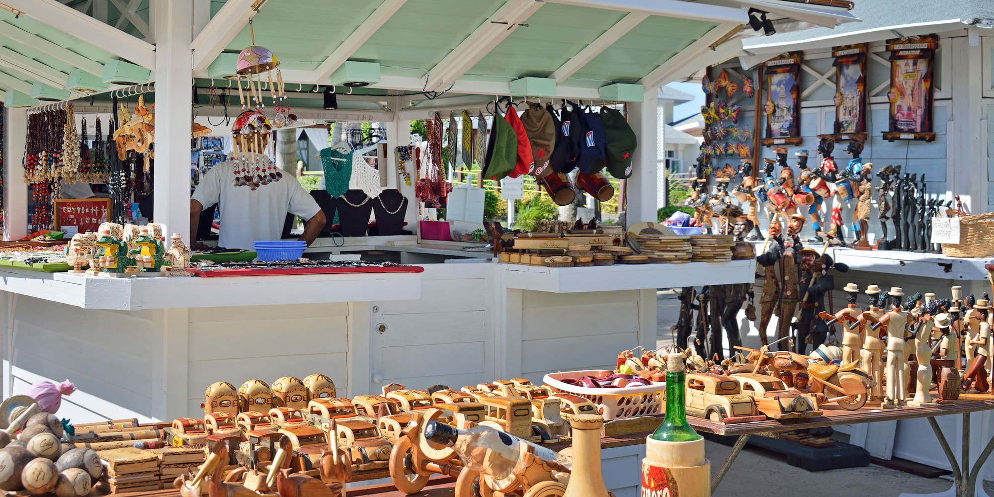 a man selling items at a market