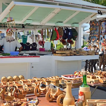 a man selling items at a market