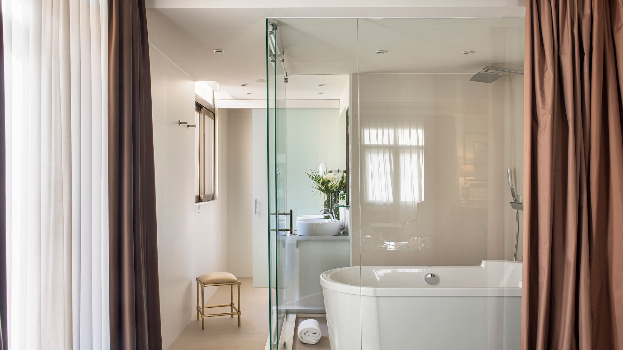 a bathroom with a tub and shower