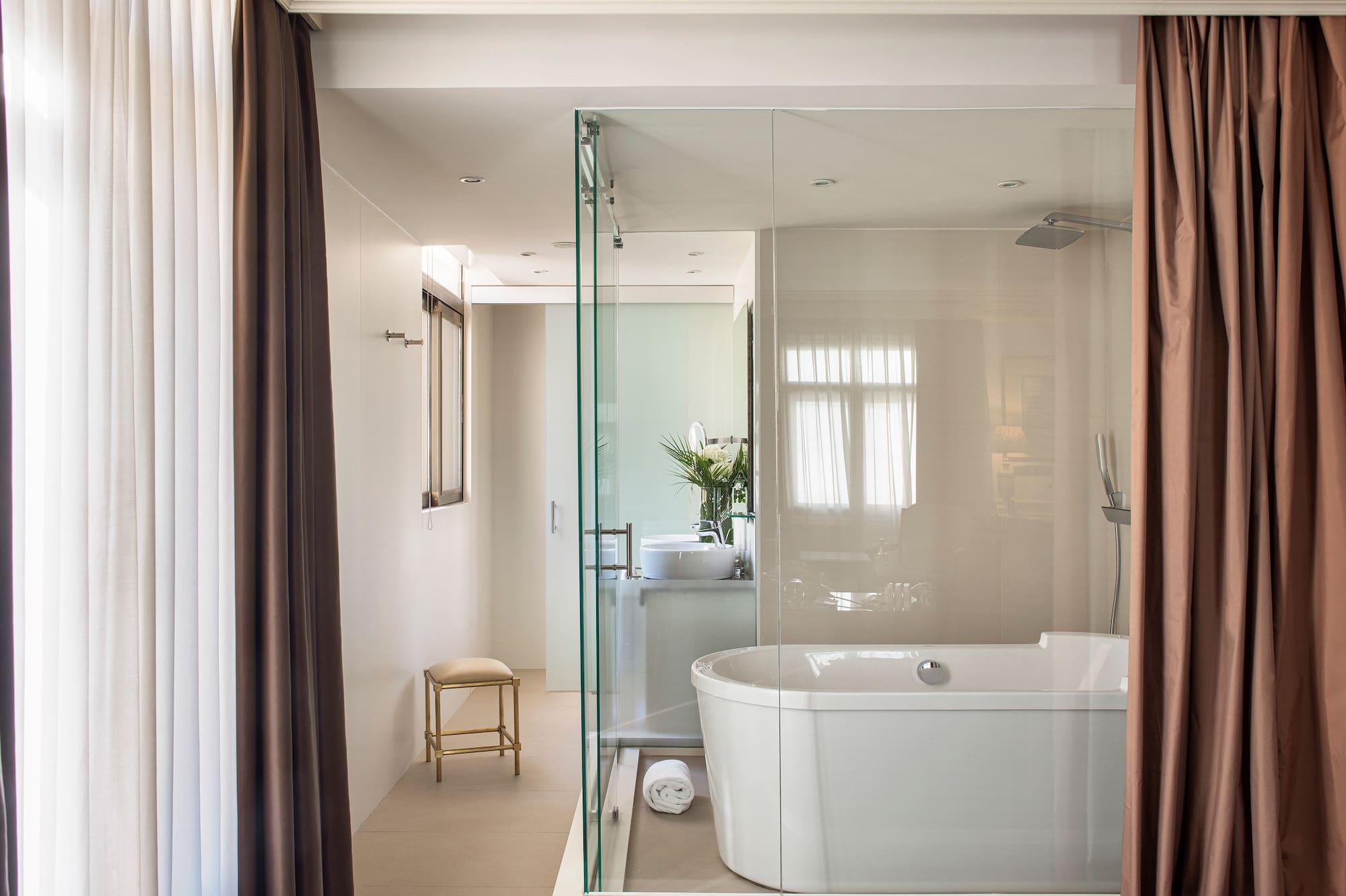 a bathroom with a tub and shower