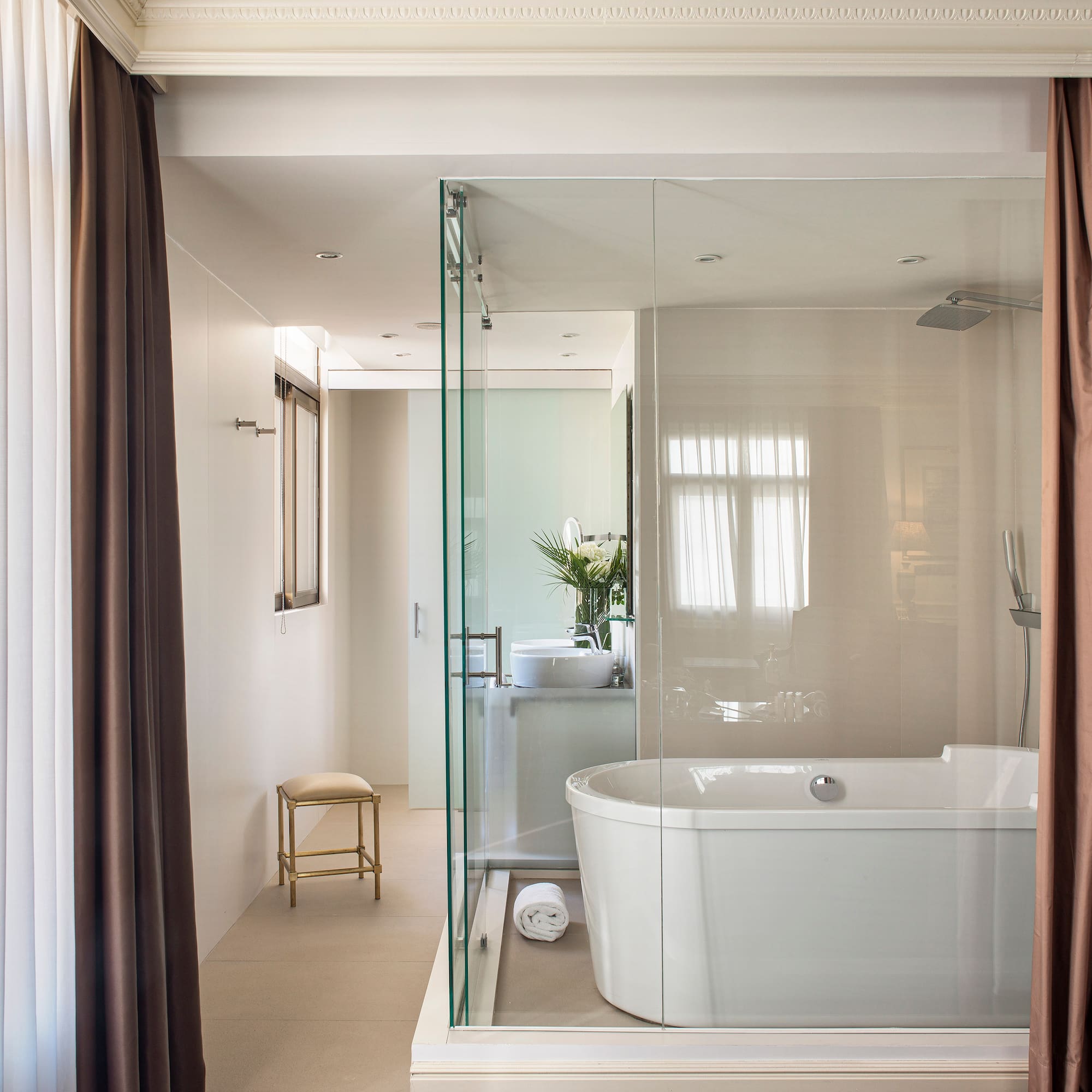 a bathroom with a tub and shower