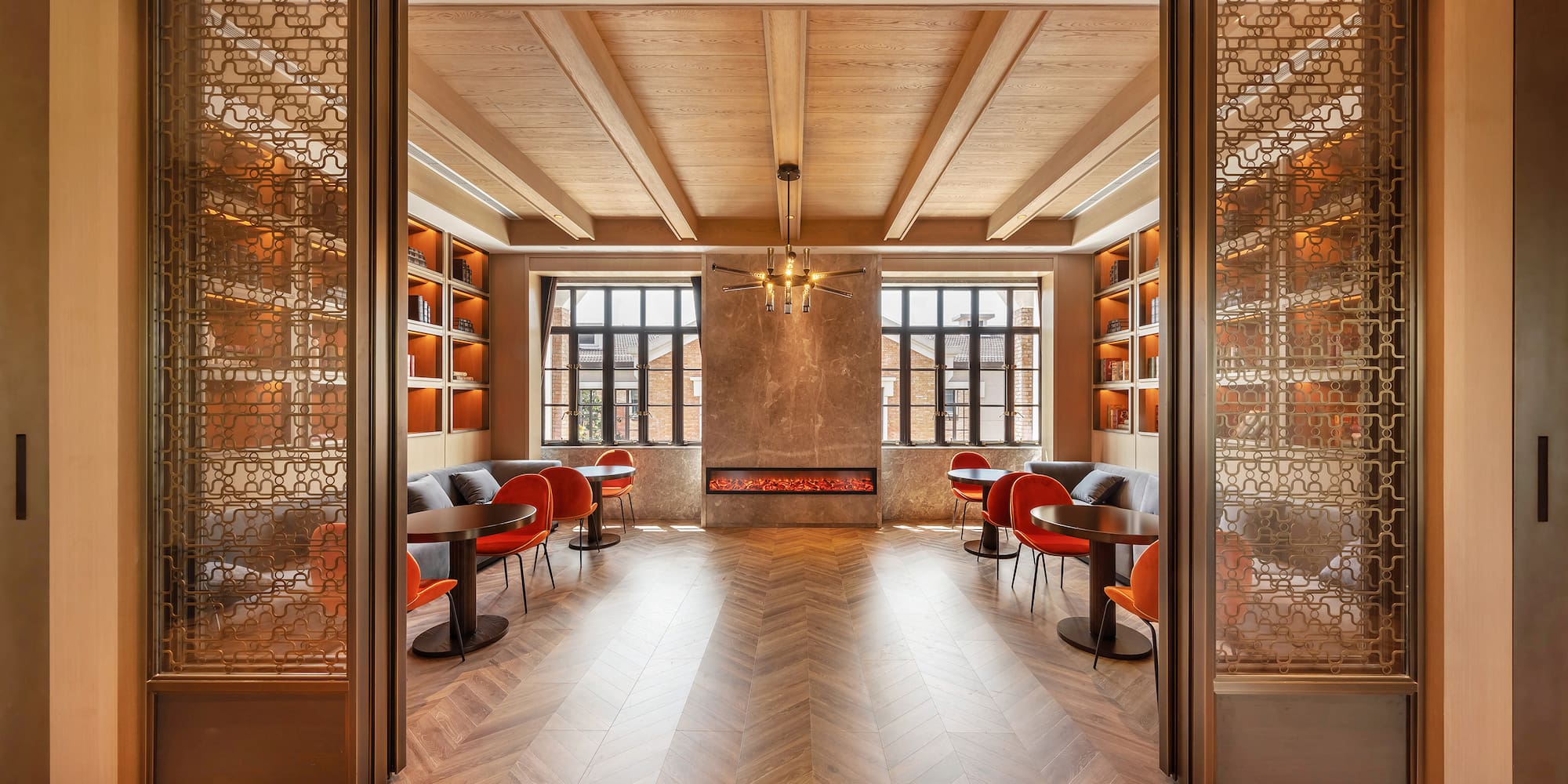 a room with a fireplace and tables