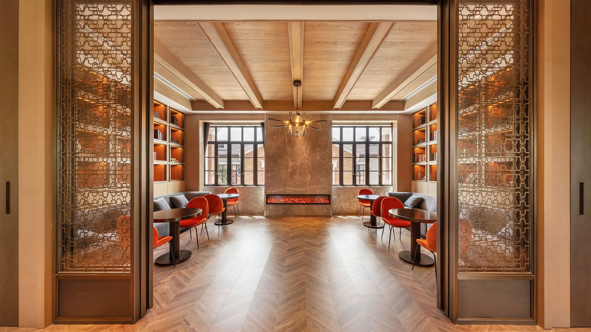 a room with a fireplace and tables