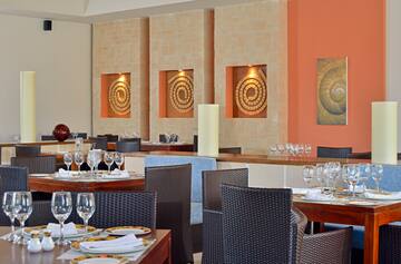 a restaurant with tables and chairs