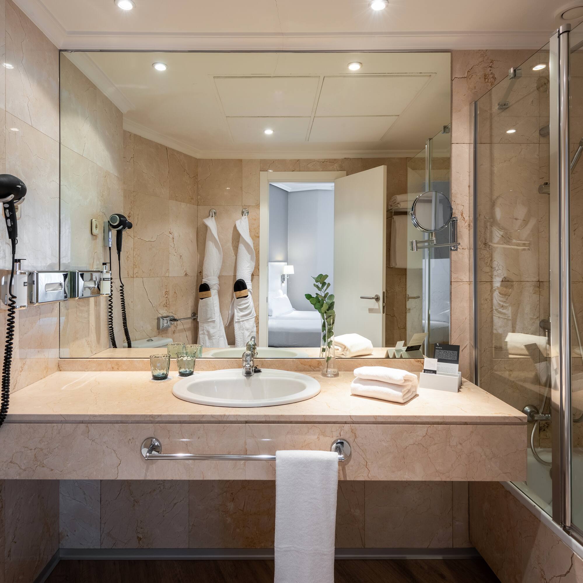 a bathroom with a mirror and sink