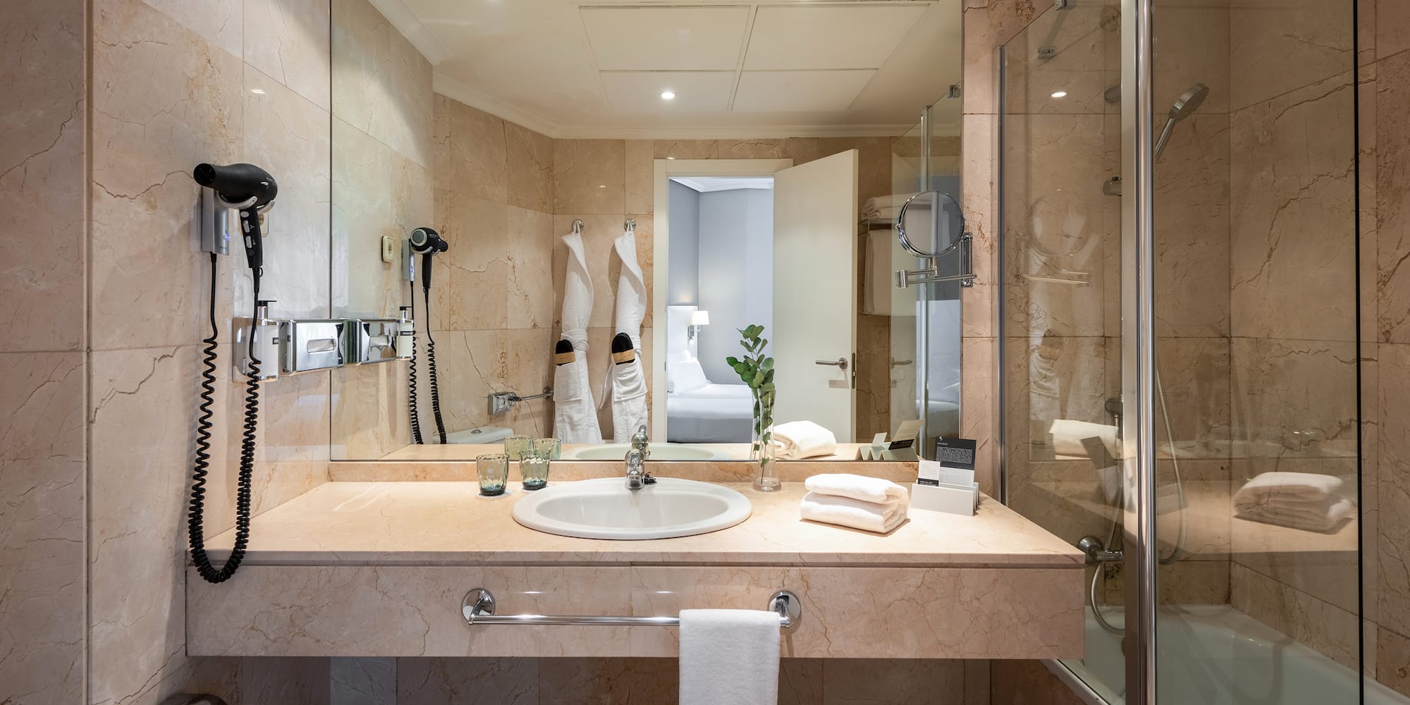 a bathroom with a mirror and sink