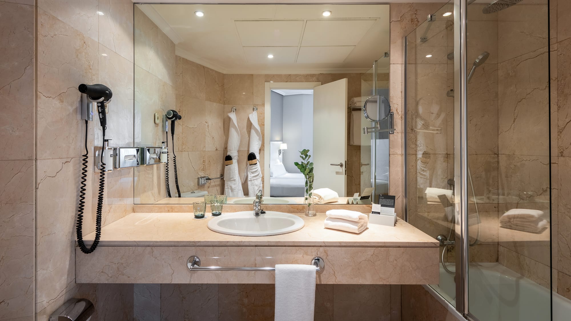 a bathroom with a mirror and sink