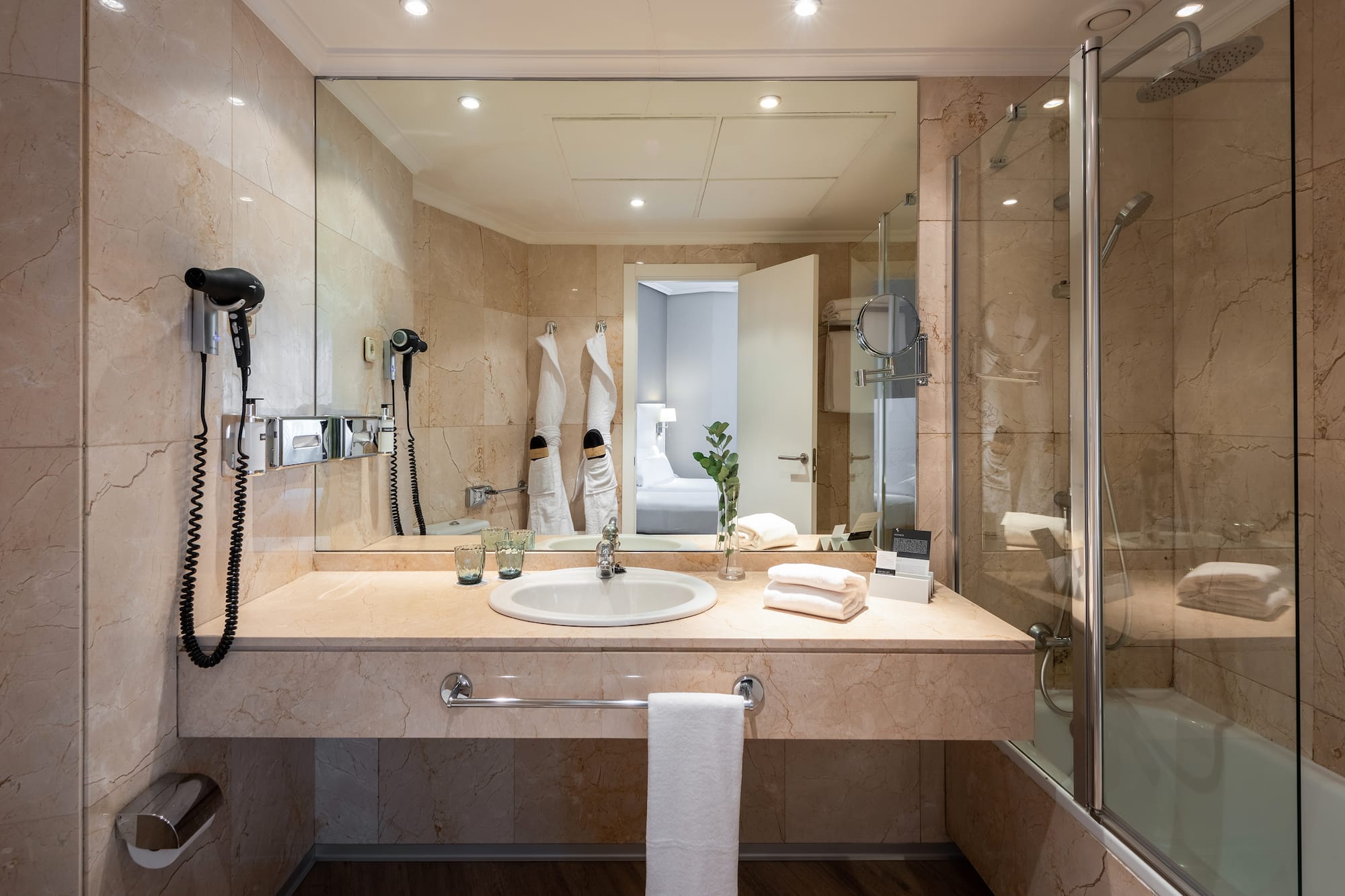 a bathroom with a mirror and sink