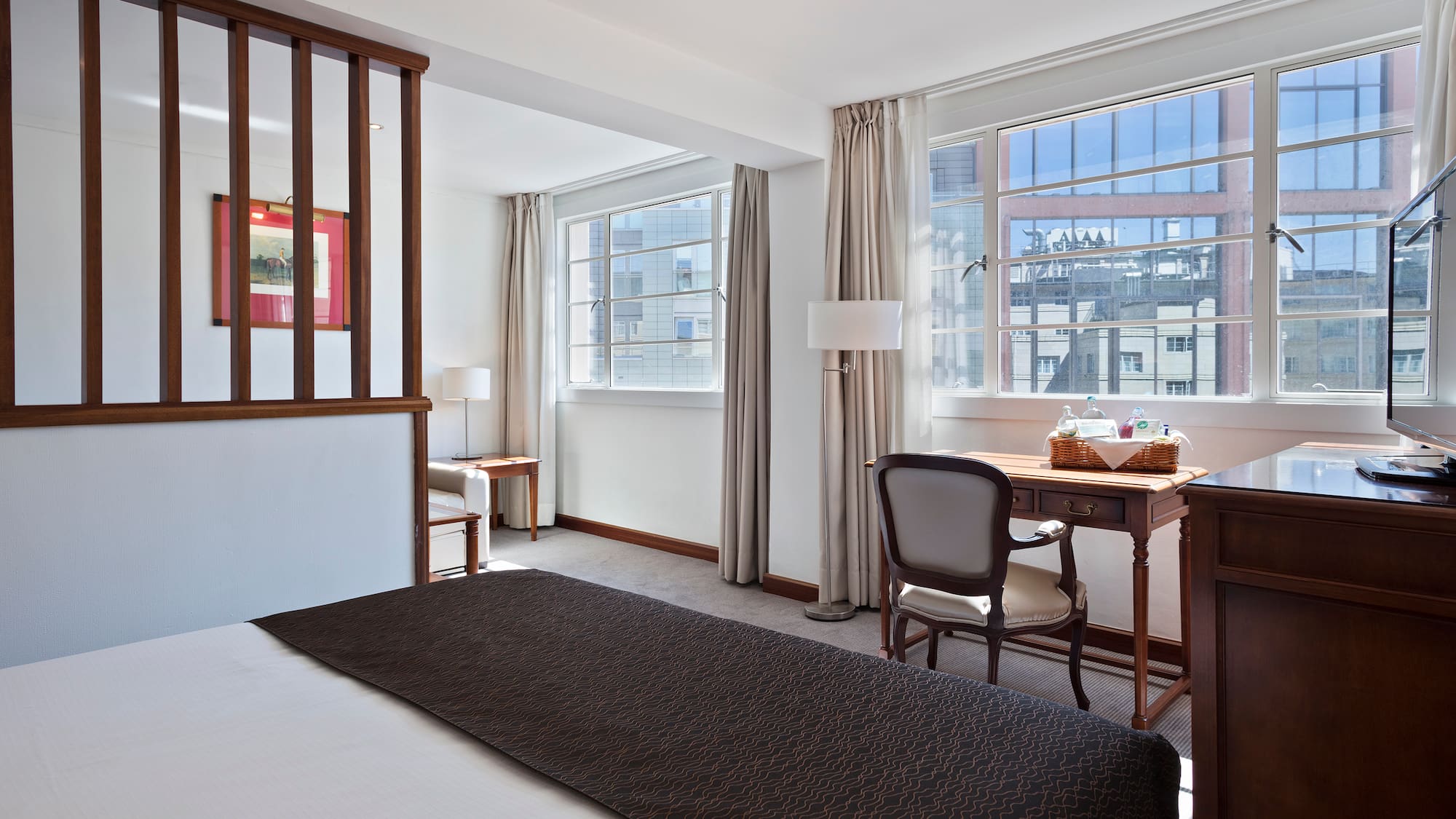 a room with a bed and a desk