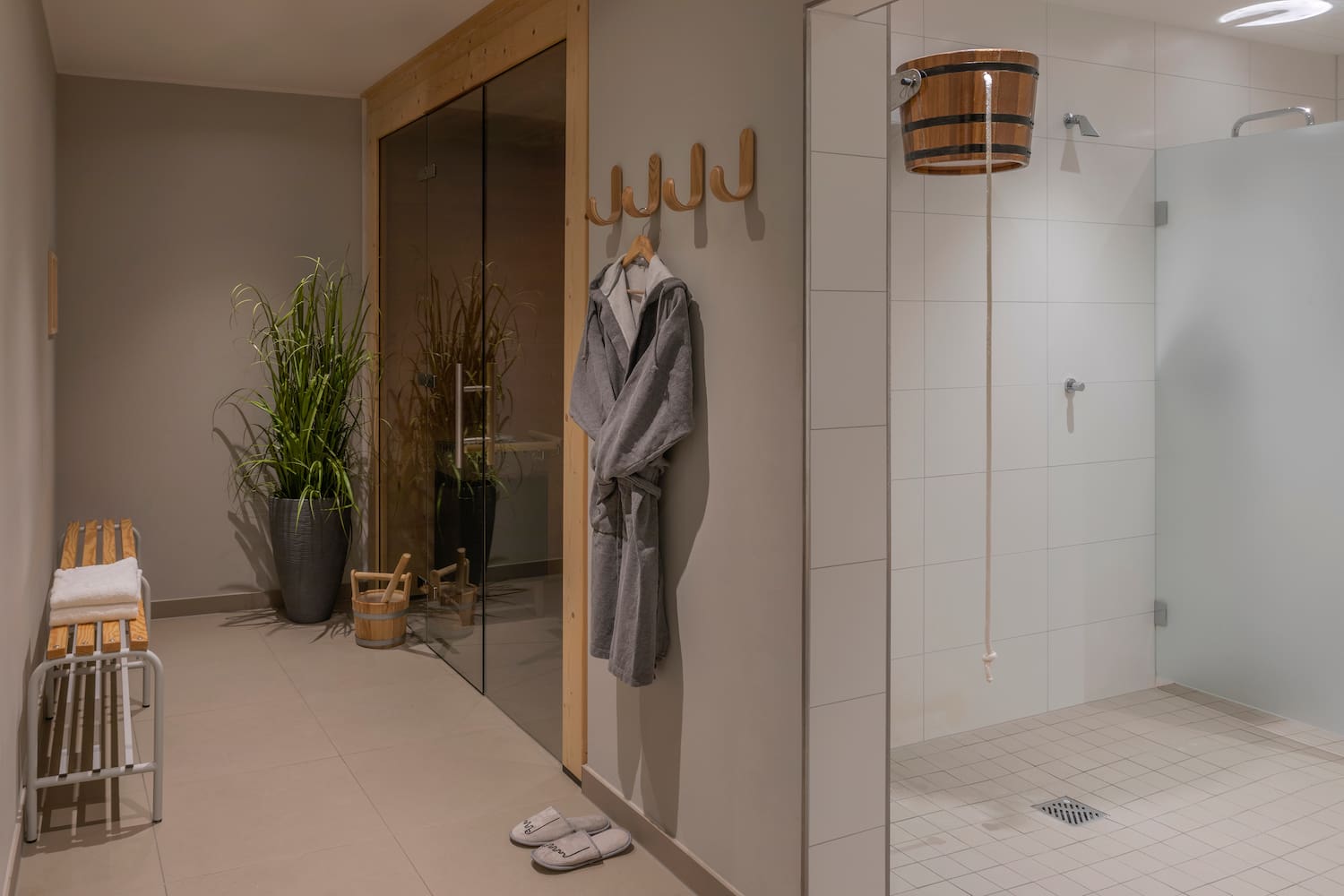 a bathroom with a bathrobe and a shower