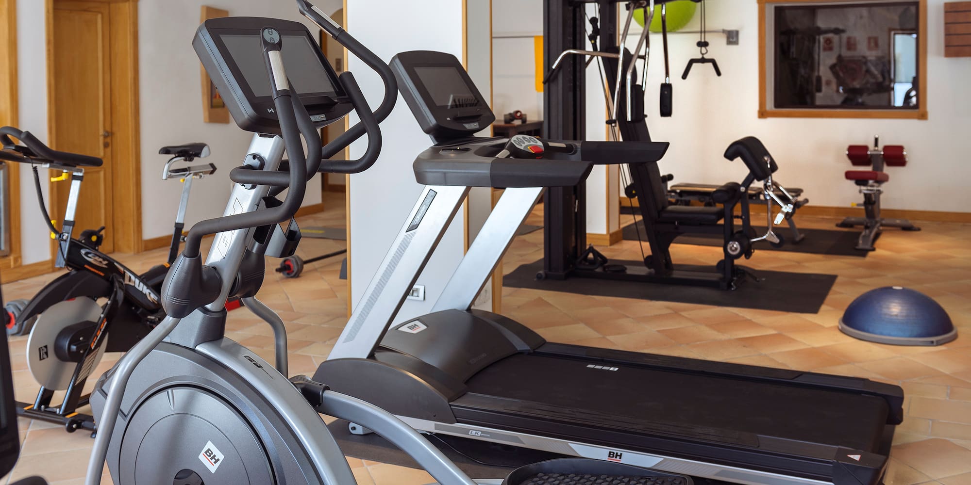 a group of treadmills in a gym