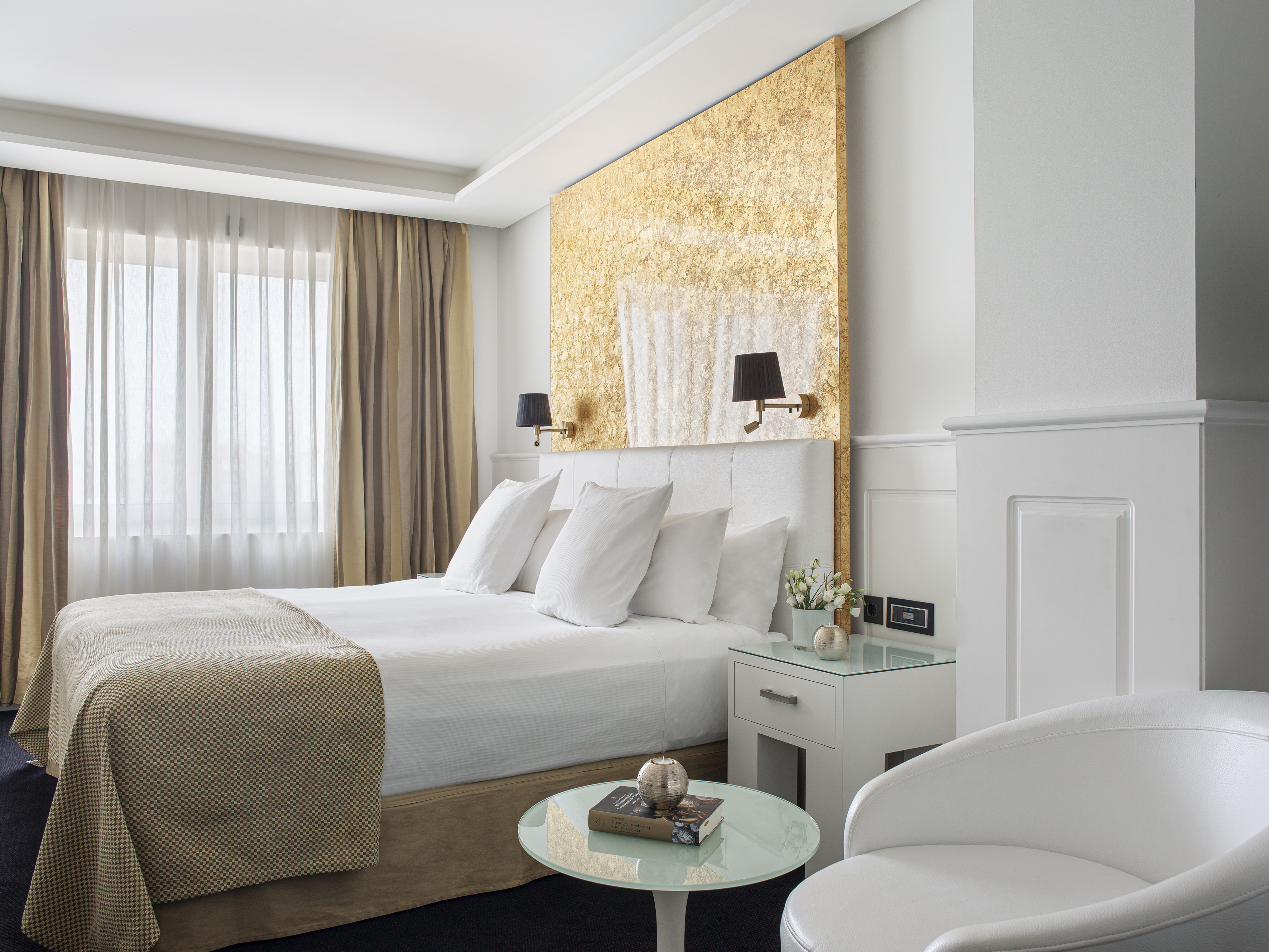 a bedroom with a bed and a table