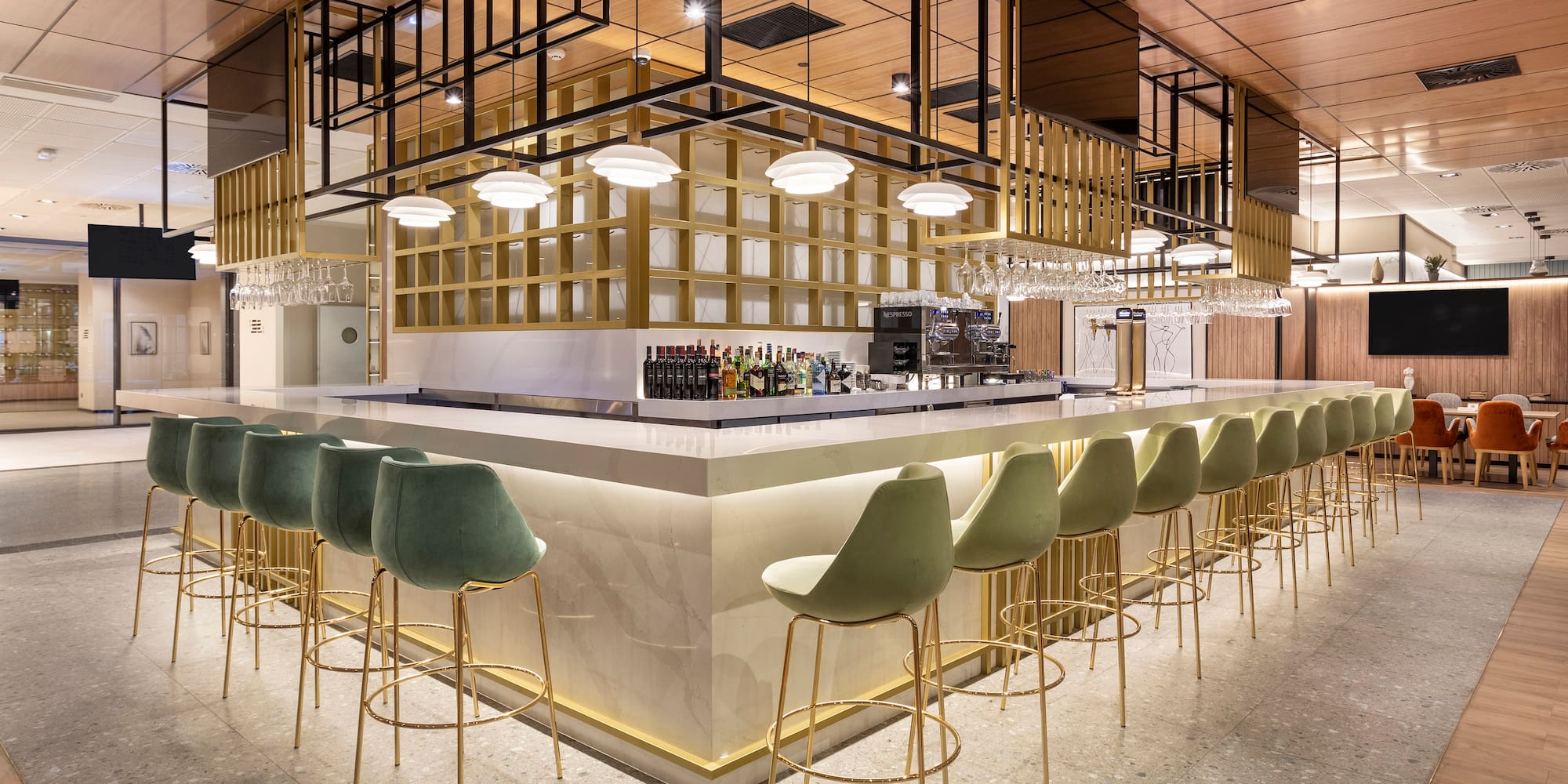 a bar with chairs and a counter