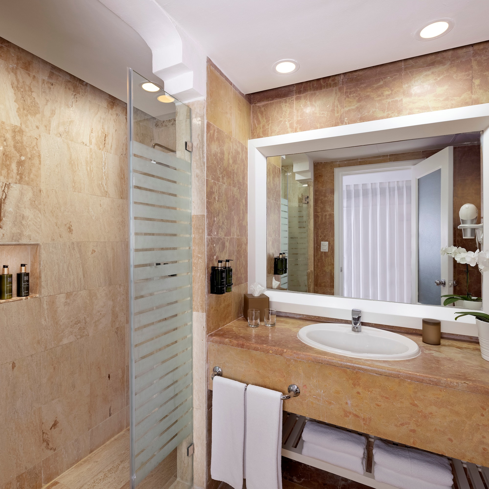 a bathroom with a sink and a shower