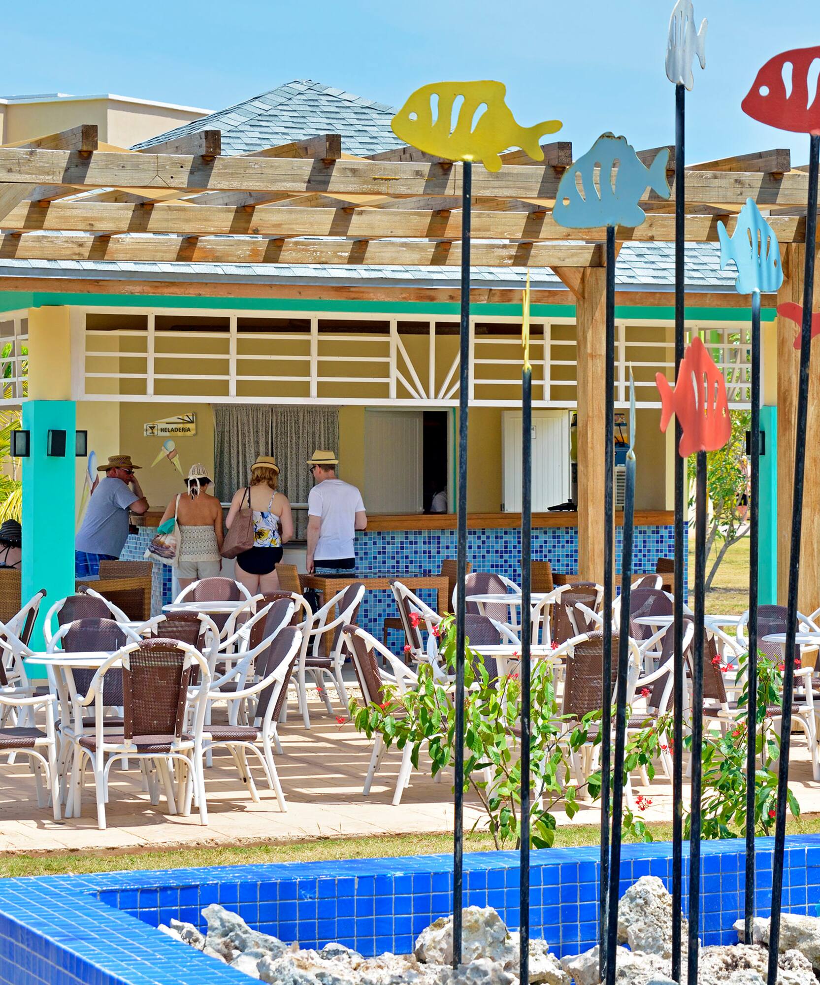a group of people standing in a restaurant