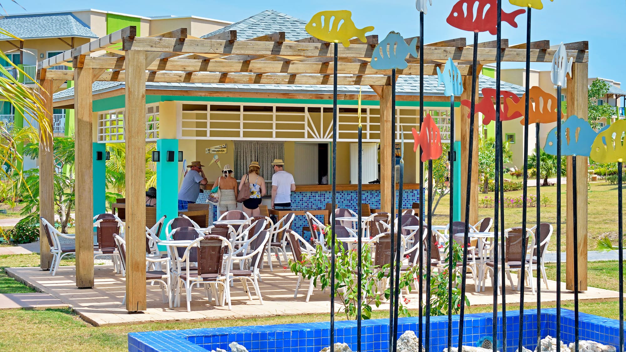 a group of people standing in a restaurant