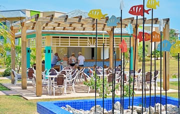 a group of people standing in a restaurant