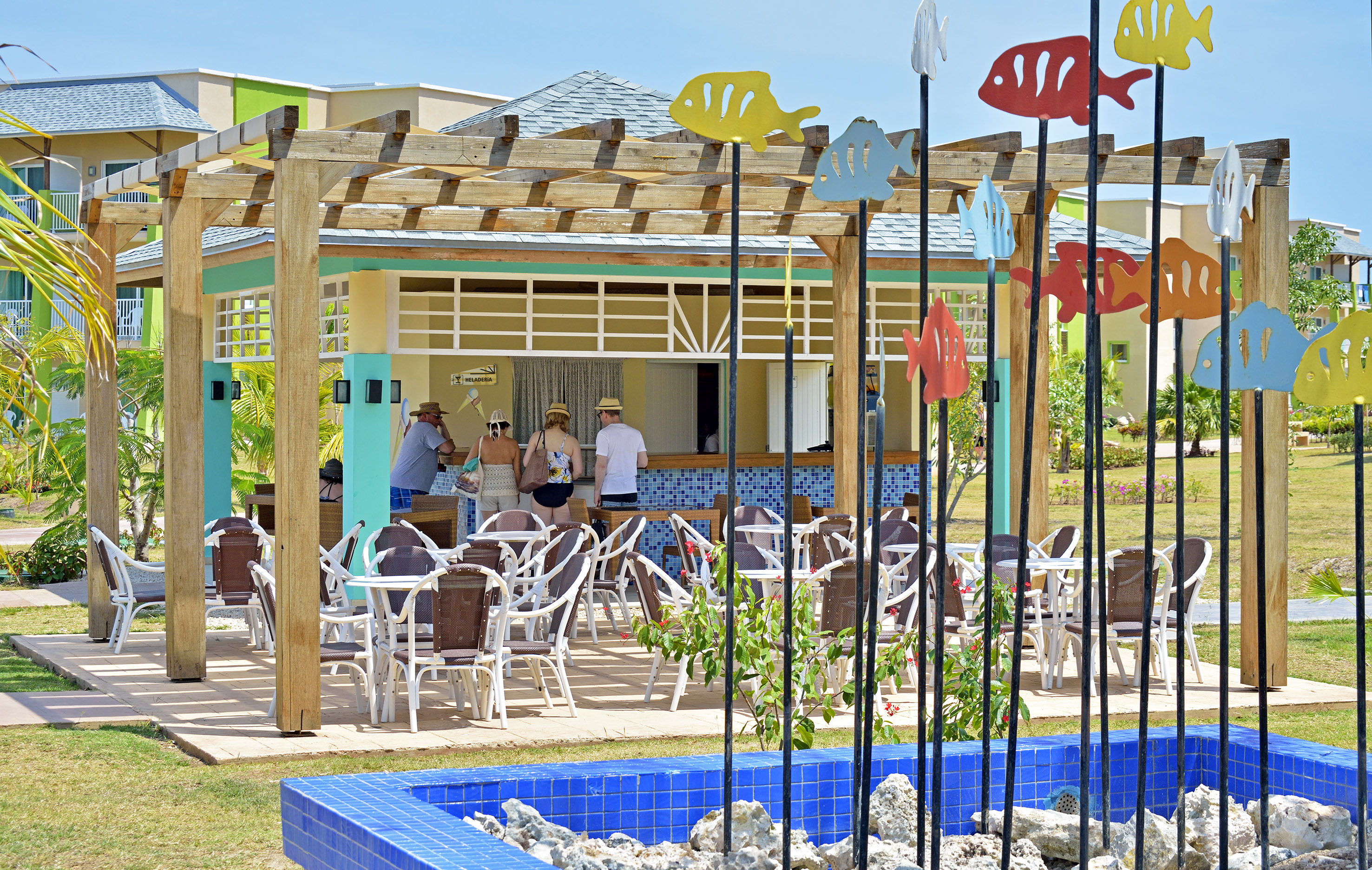 a group of people standing in a restaurant