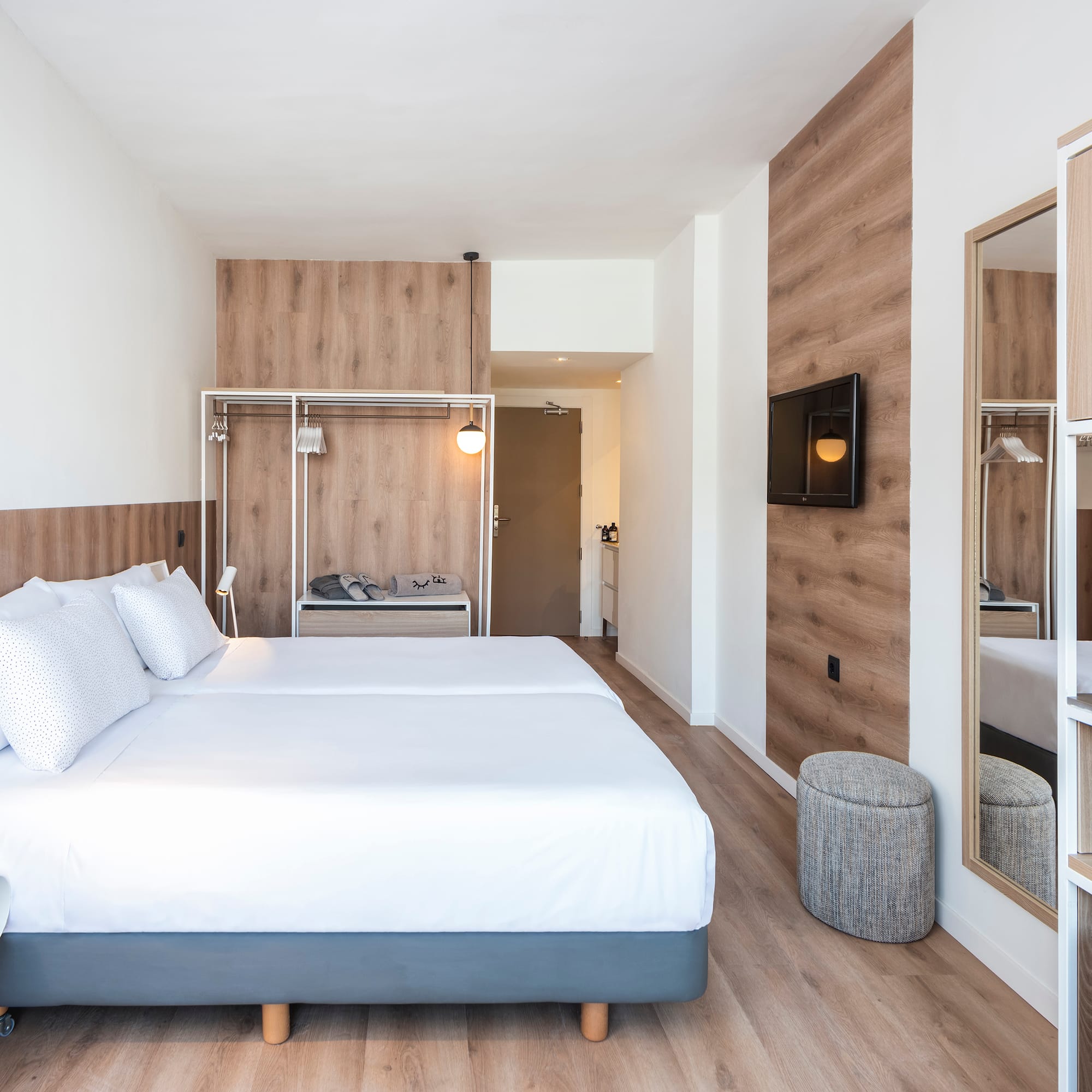 a room with a bed and a mirror