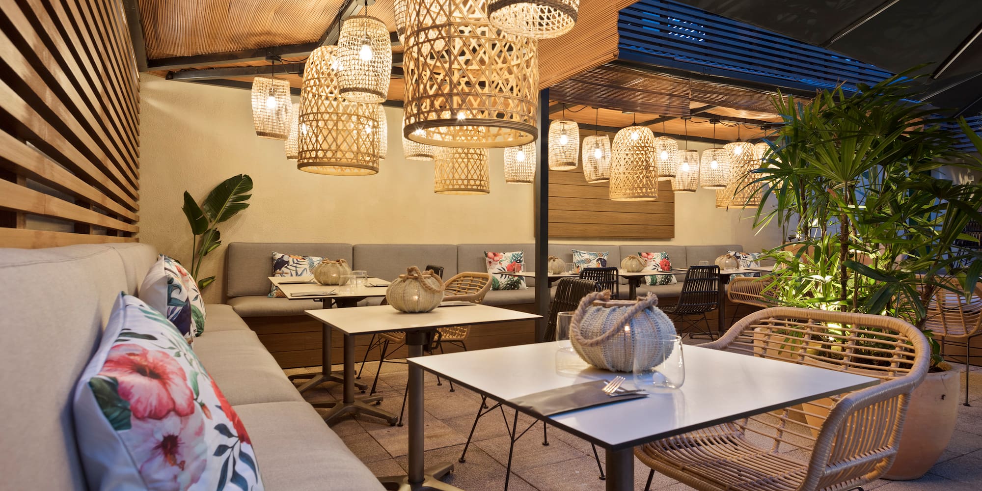 a room with tables and chairs and lamps