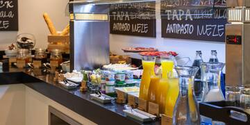 a counter with food and drinks