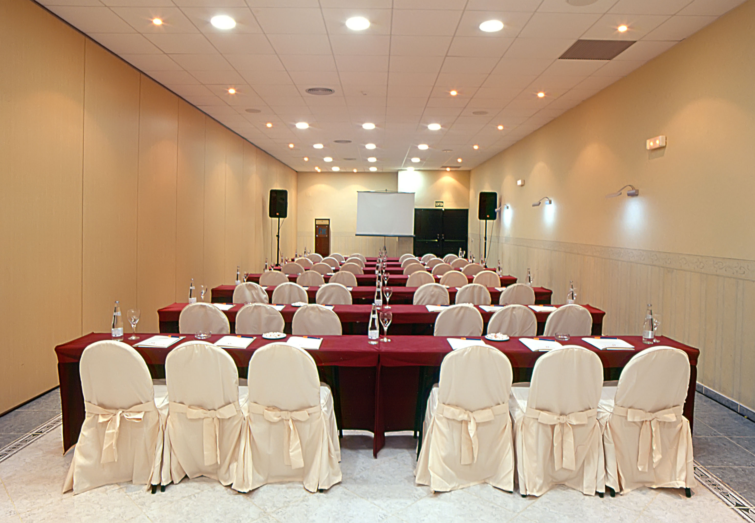 a room with tables and chairs