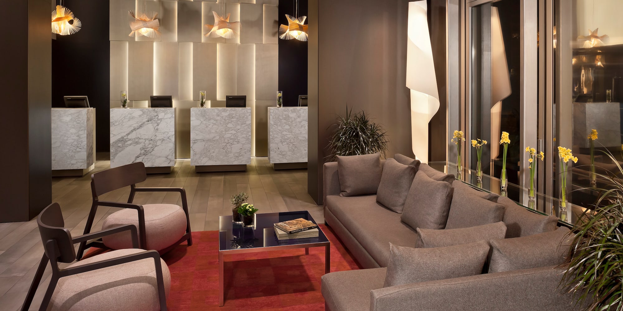 a room with a couch and chairs