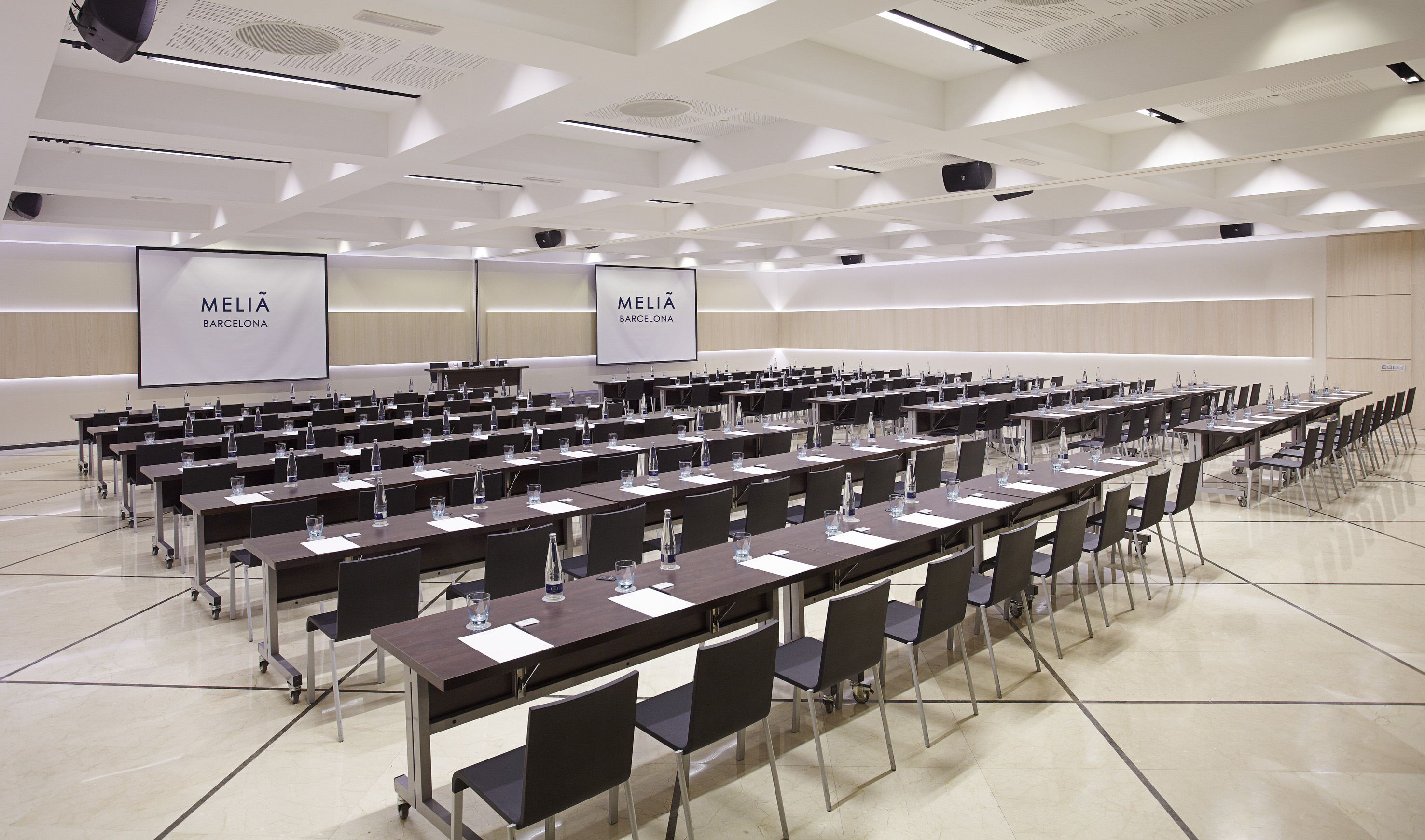 a large conference room with tables and chairs
