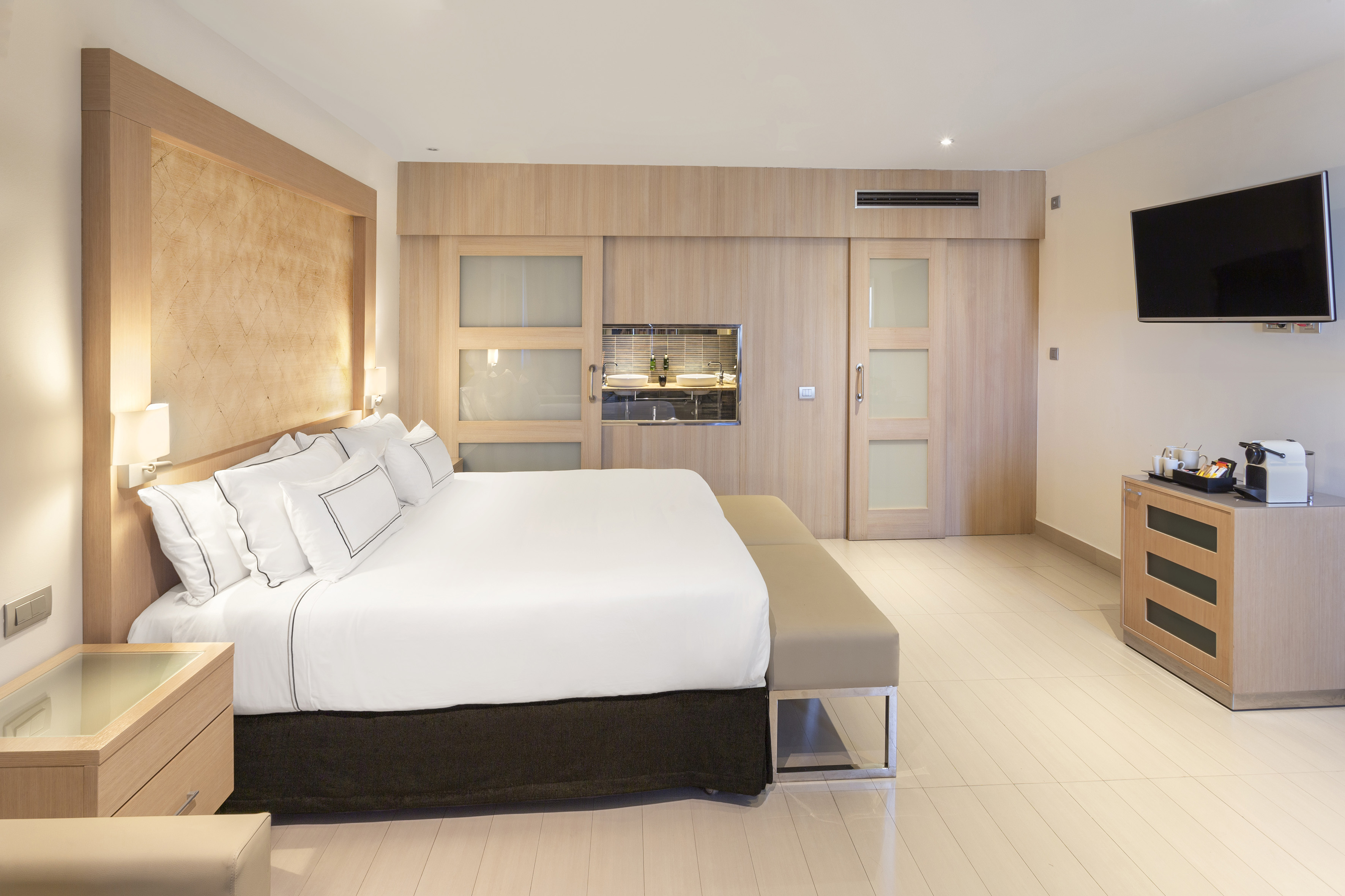 a bedroom with a bed and a fireplace