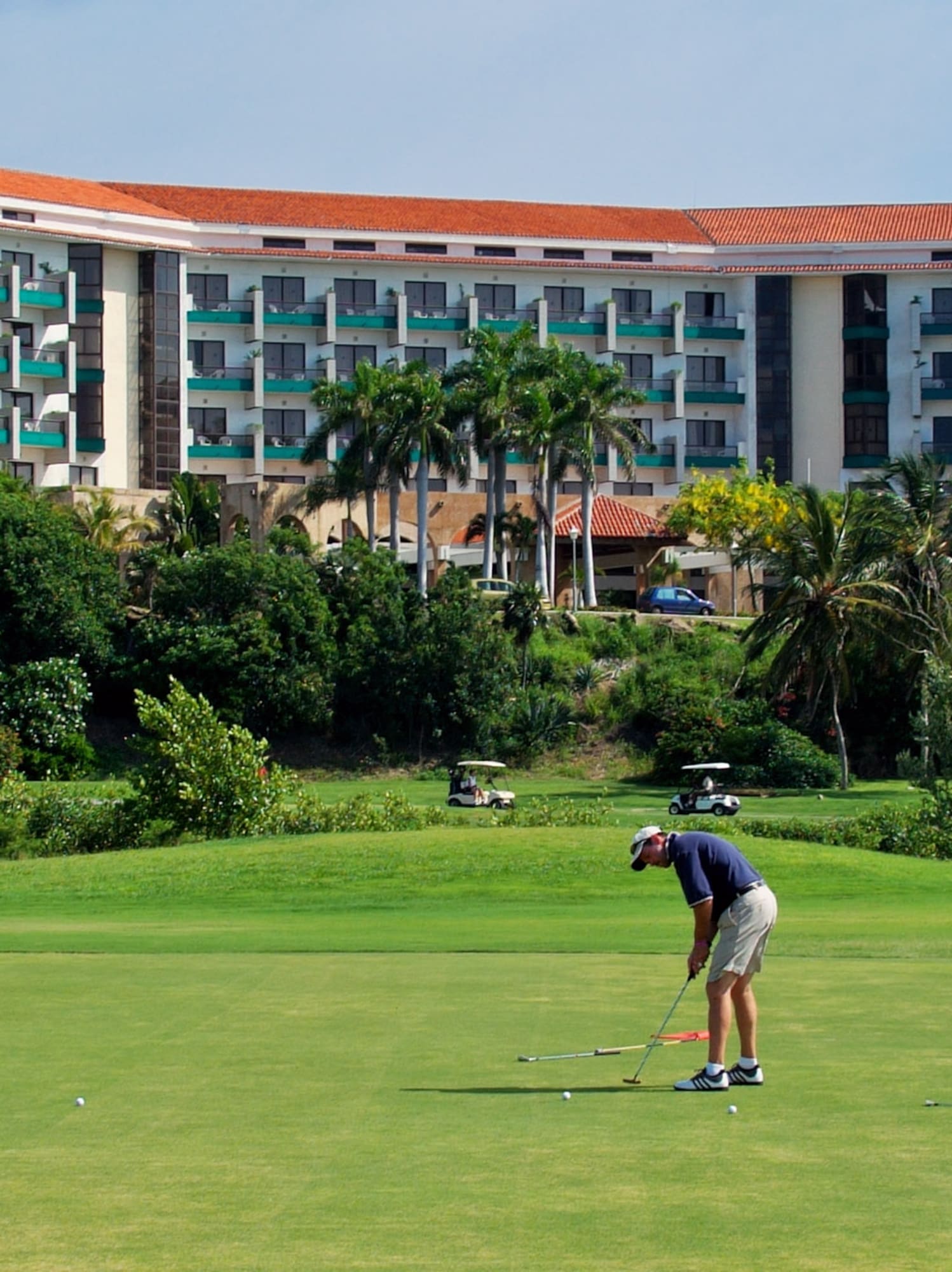 a man playing golf on a golf course