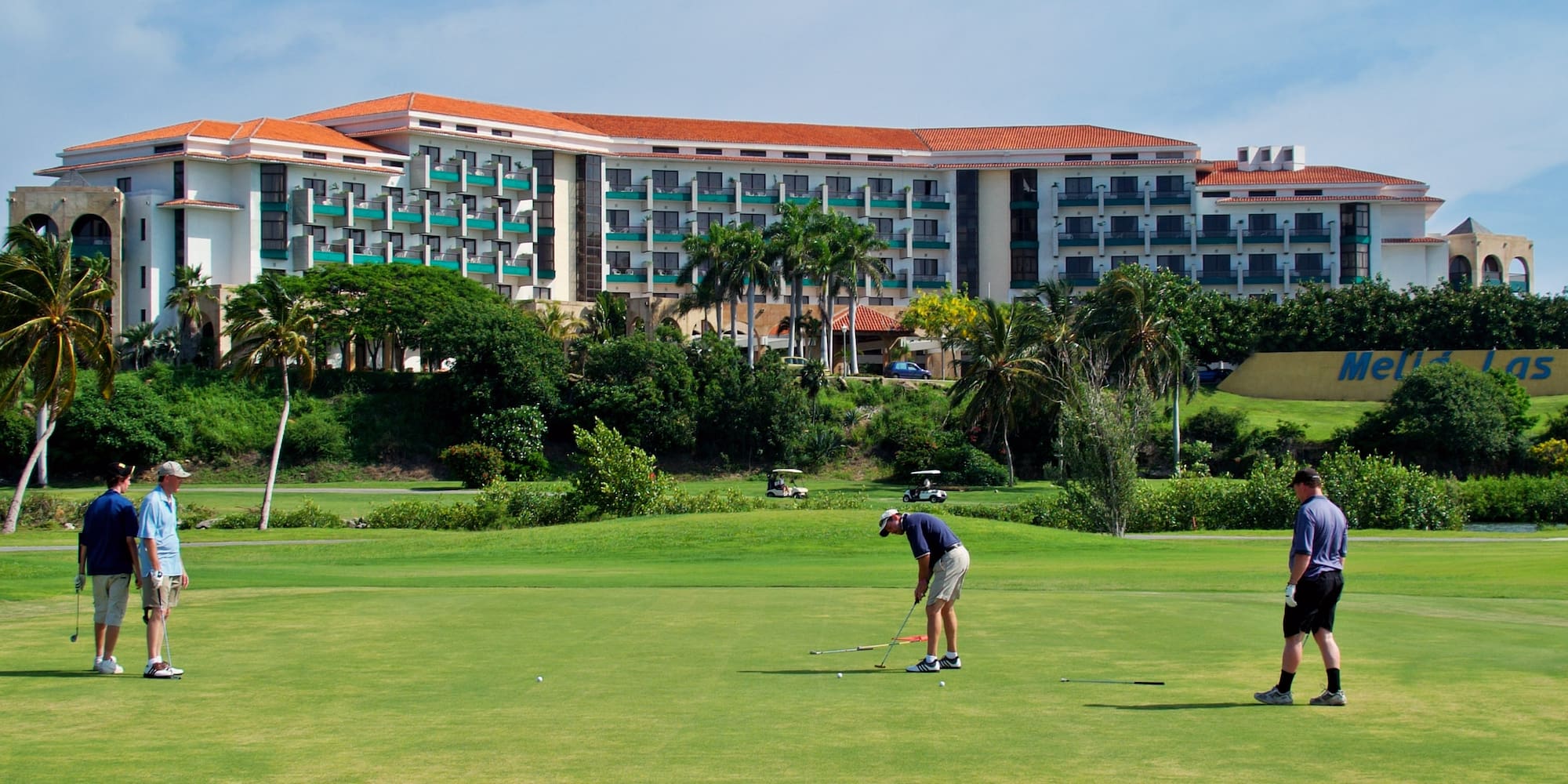 a man playing golf on a golf course
