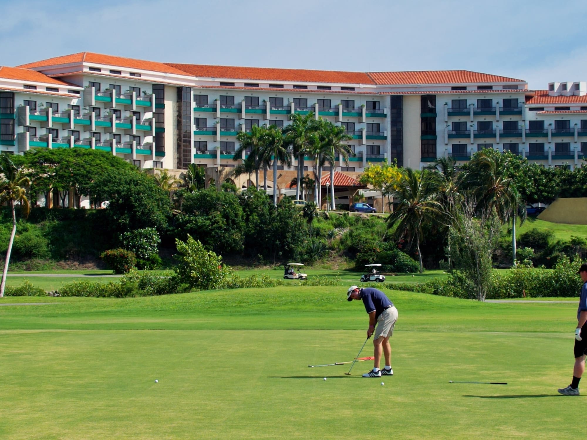 a man playing golf on a golf course