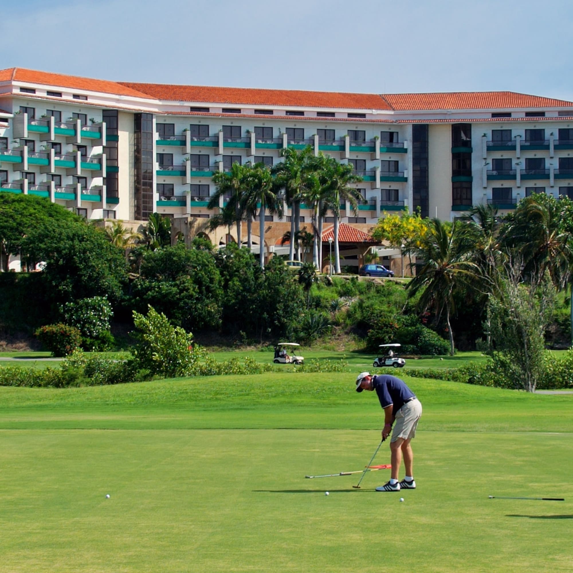 a man playing golf on a golf course