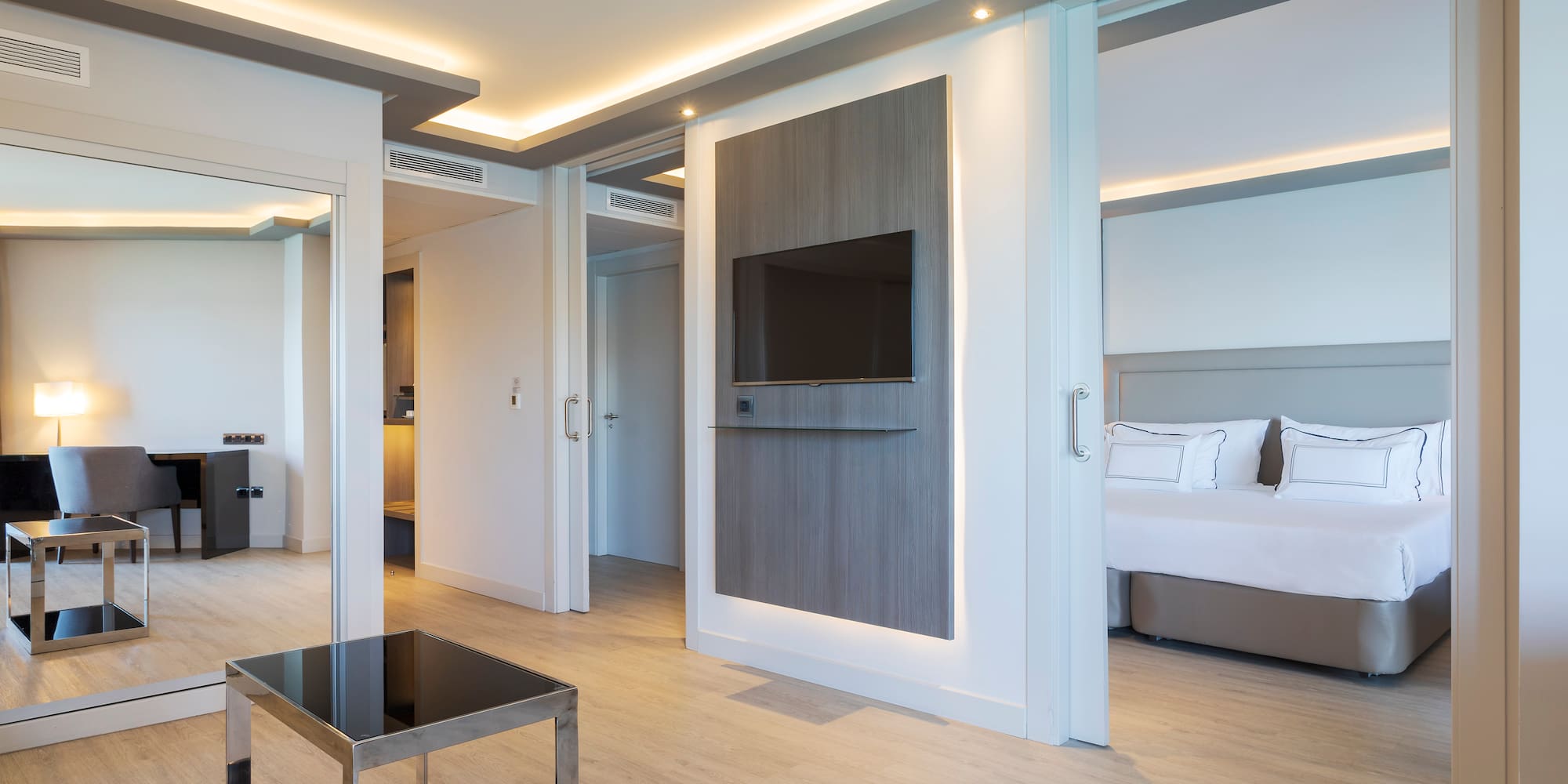 a room with a tv and a bed