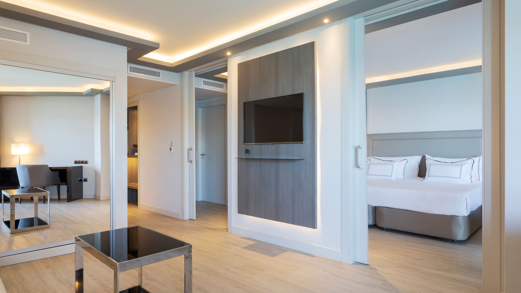 a room with a tv and a bed