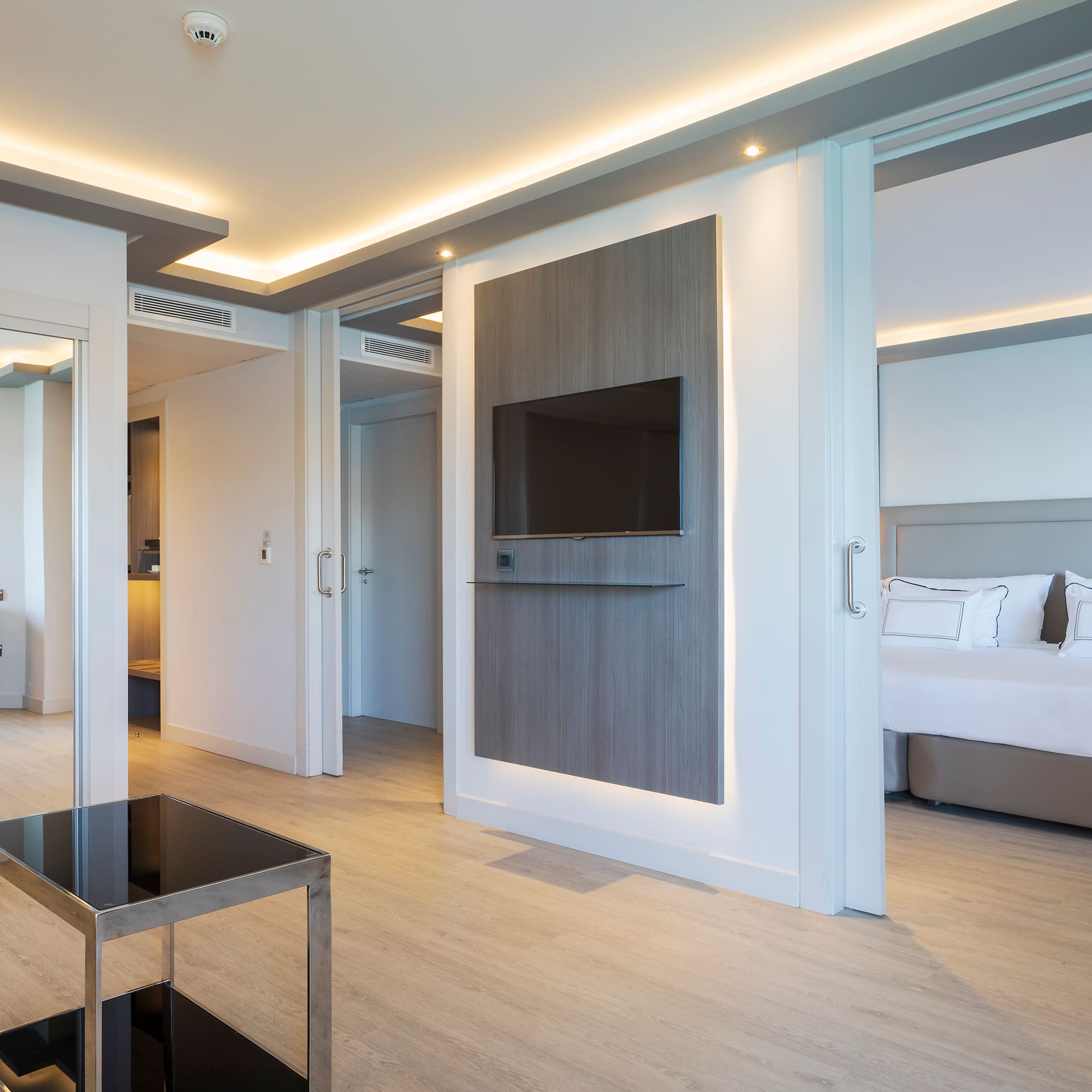 a room with a tv and a bed