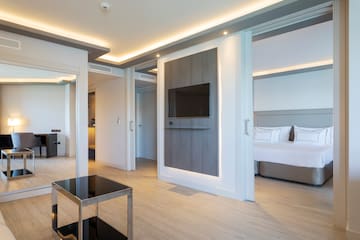 a room with a tv and a bed